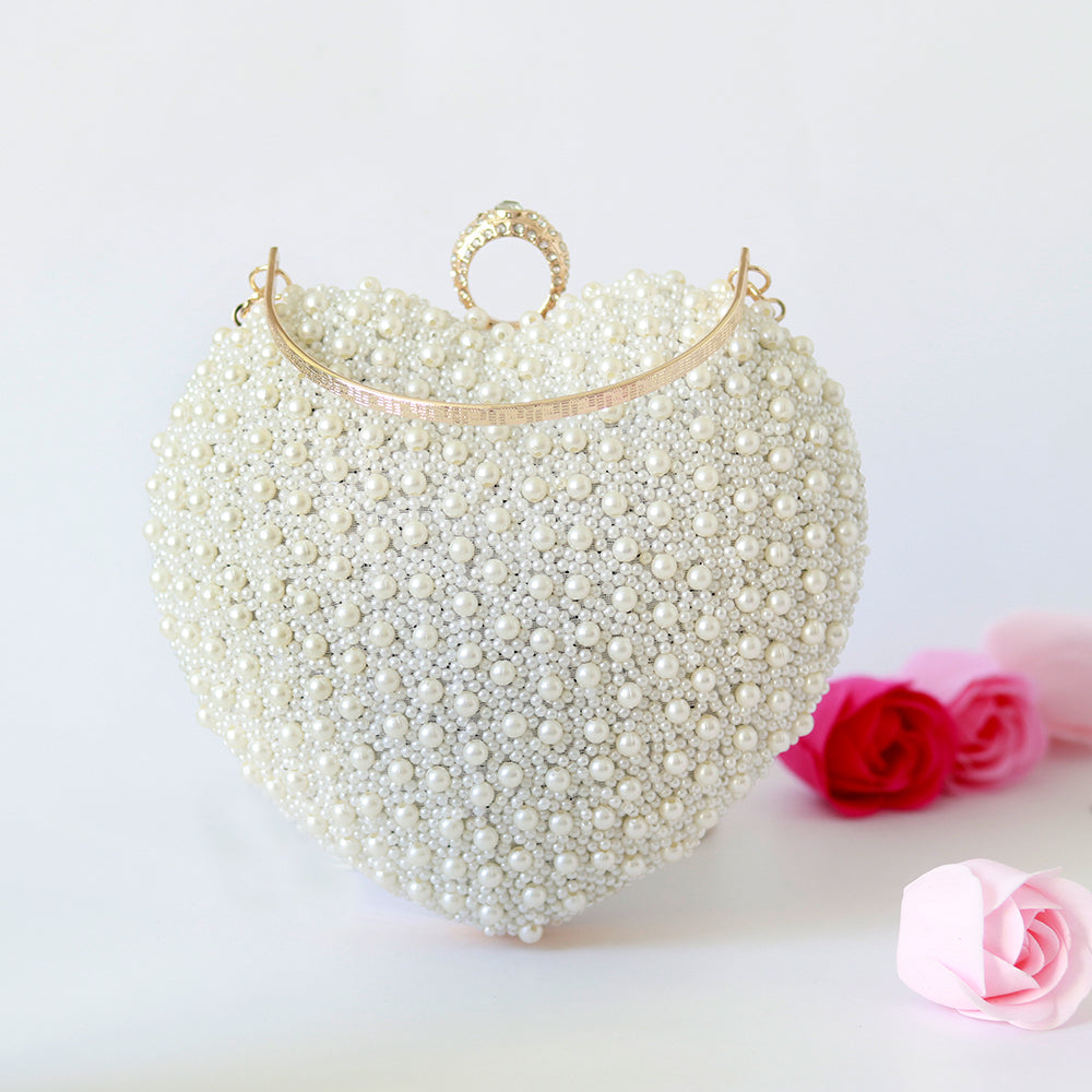 THE TAN CLAN Ulfat All White Pearl Hand Embroidered Heart Clutch
