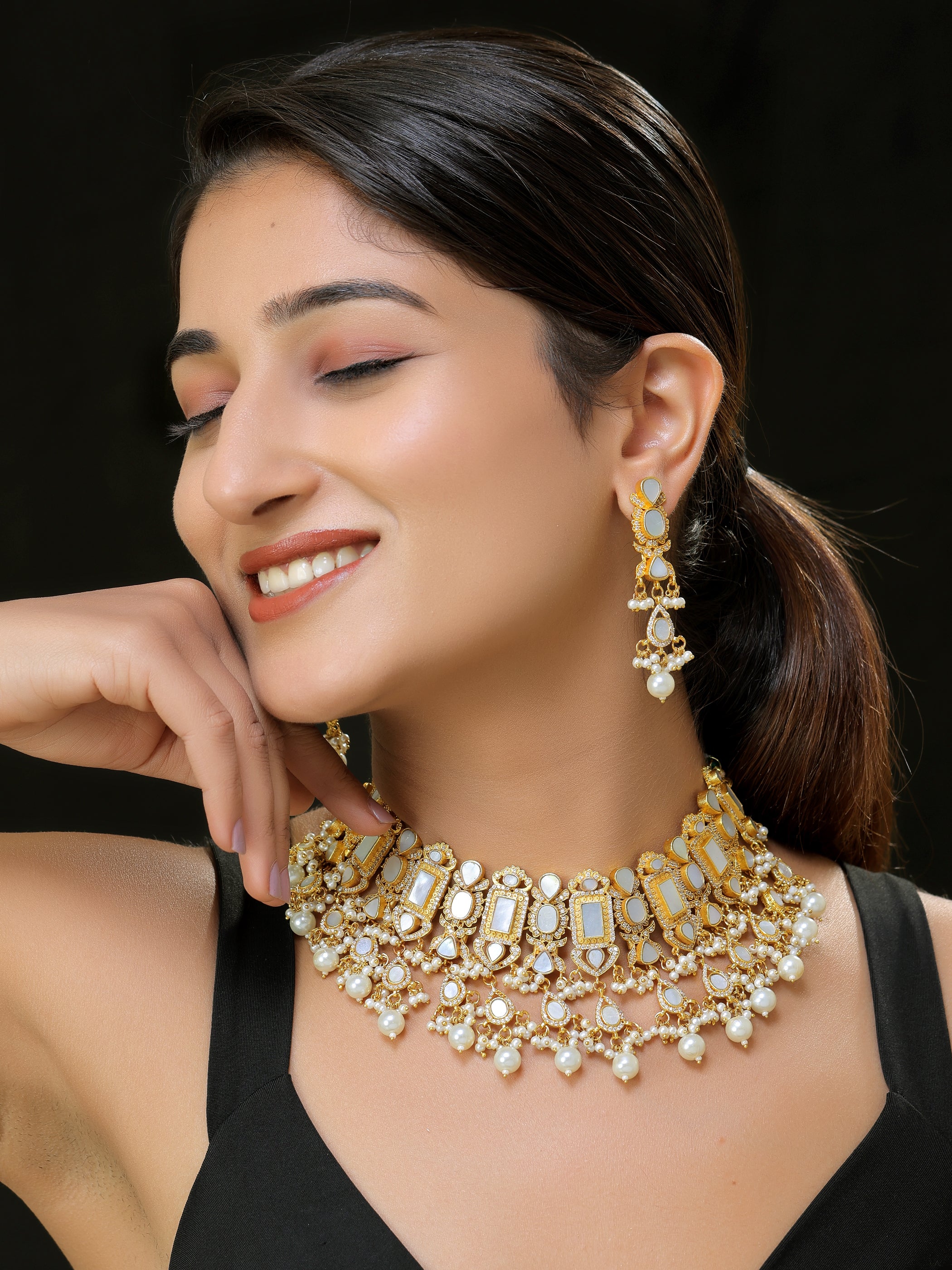 Gold finish Kundan and mother of pearls necklace set