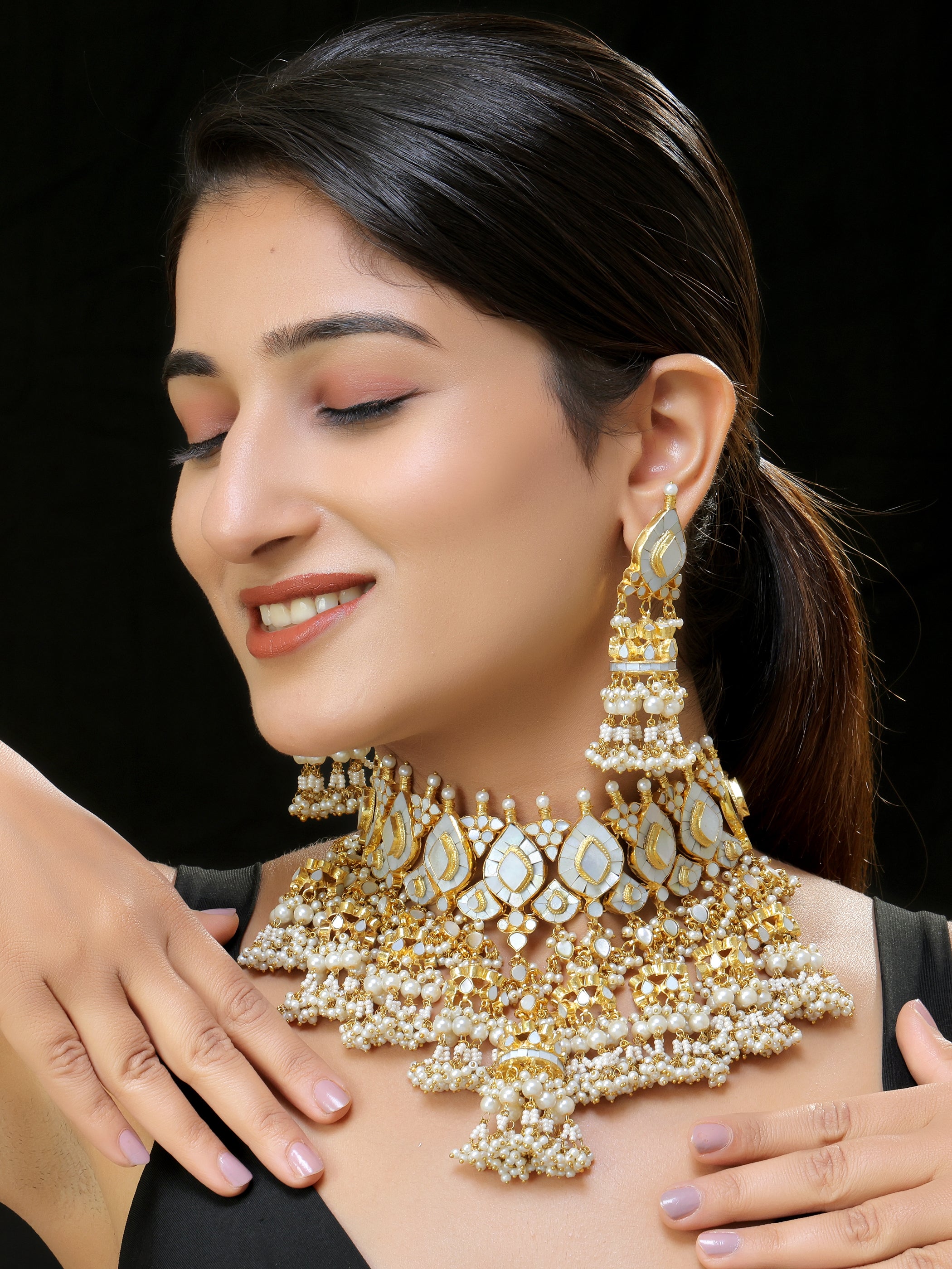 Gold finish Kundan and mother of pearls necklace set