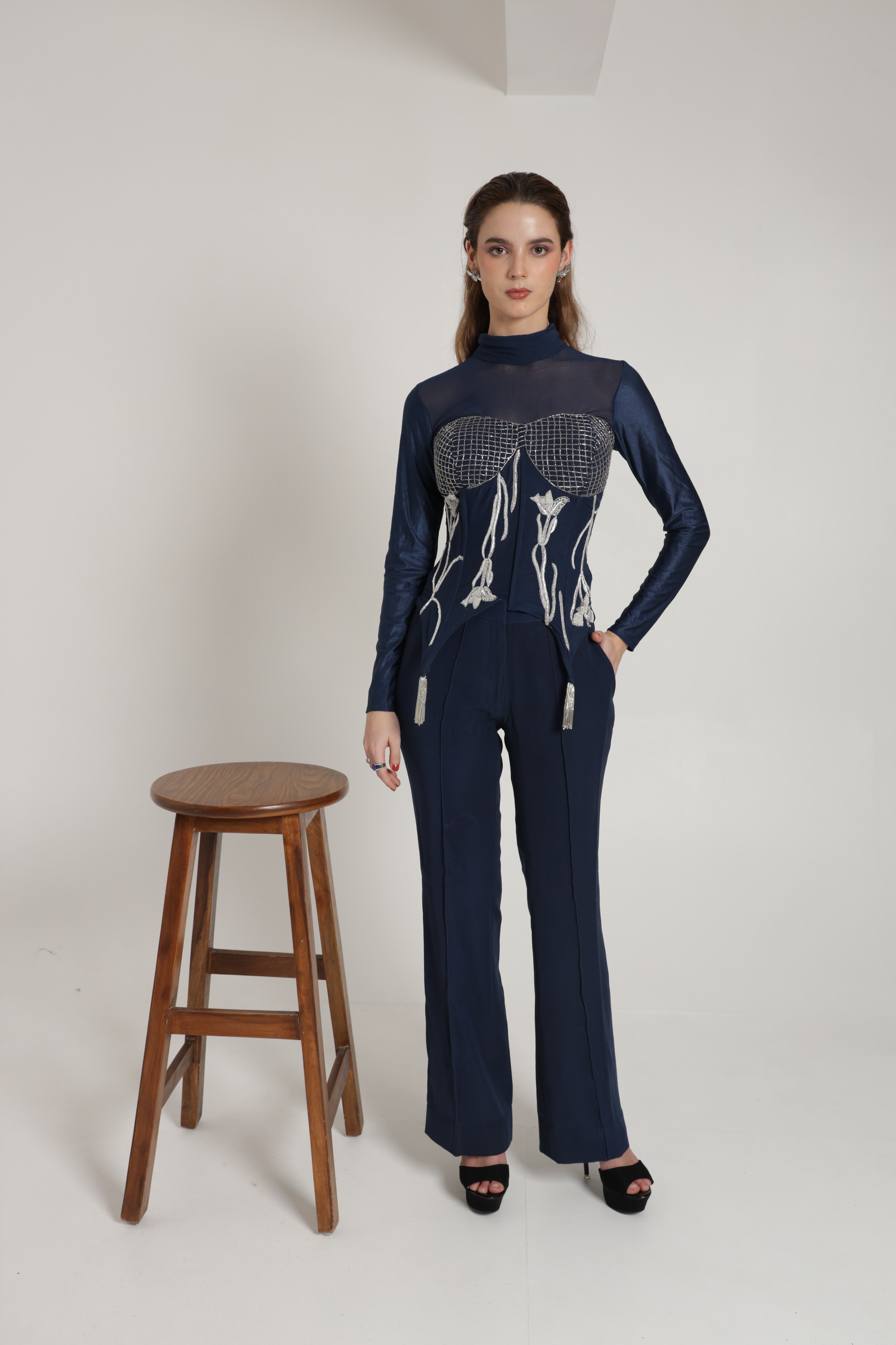 Dark blue high neck corset top with straigh pants