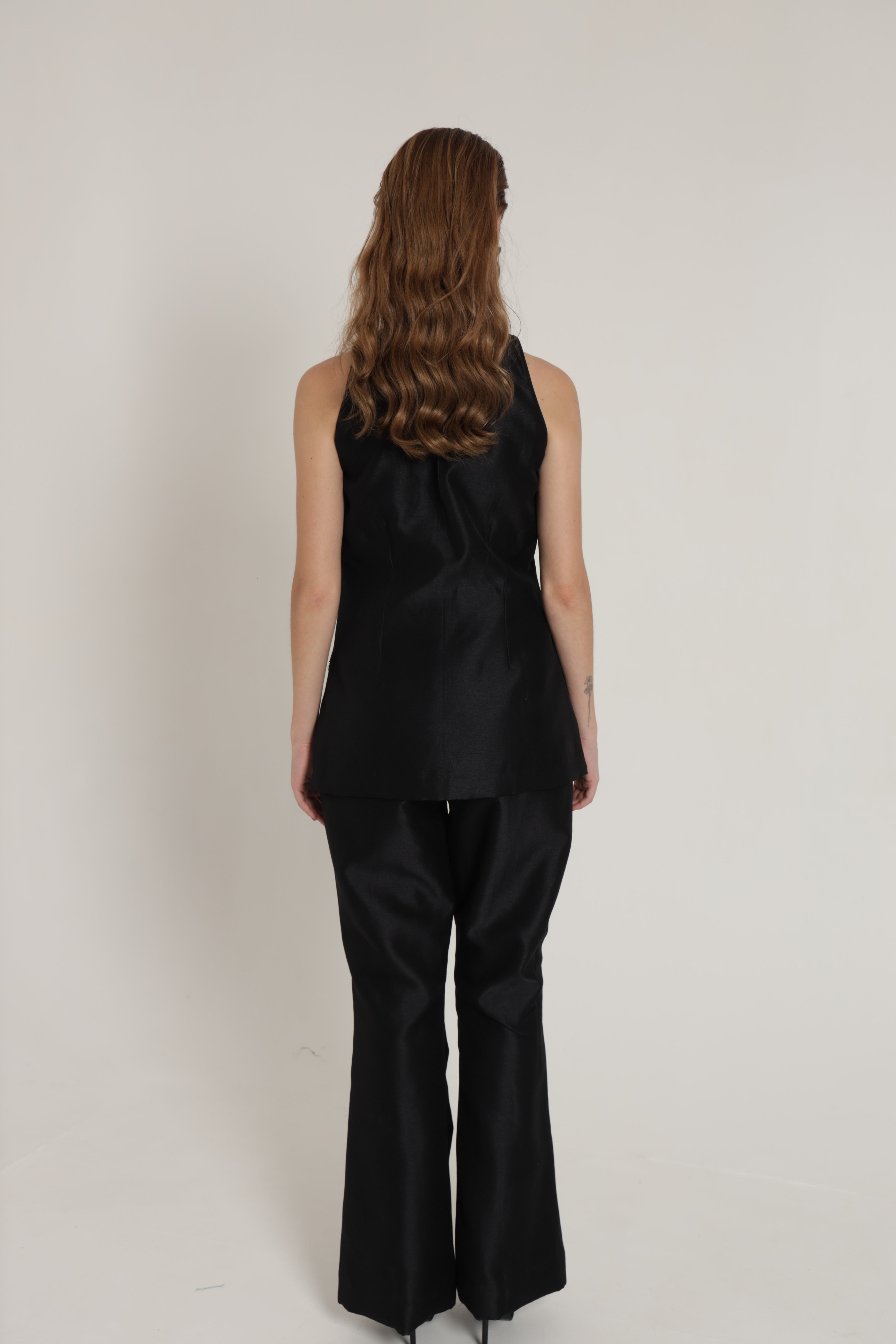 Black halter neck top with bell bottom pants