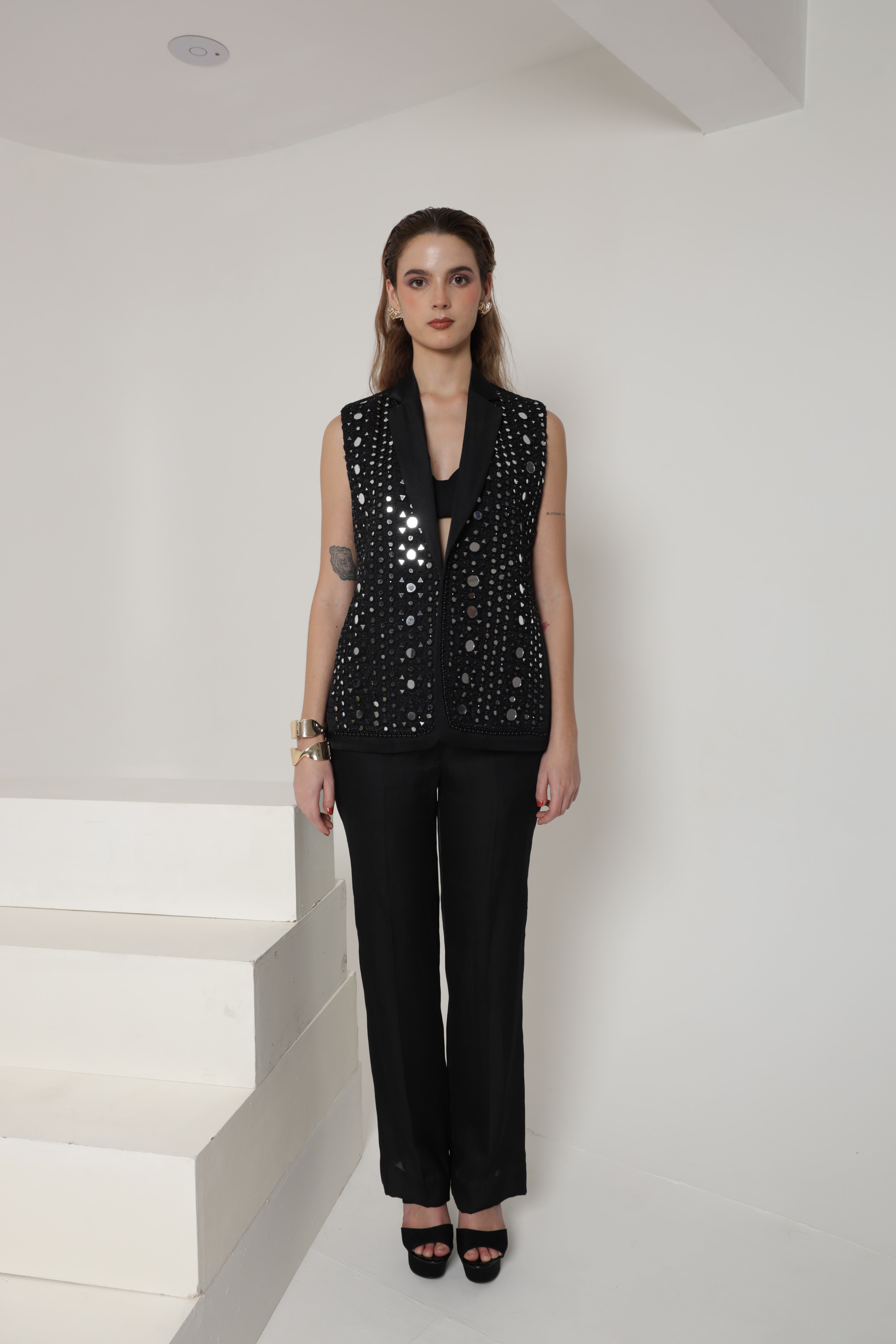 Black sleeveless jacket with pant and bustier