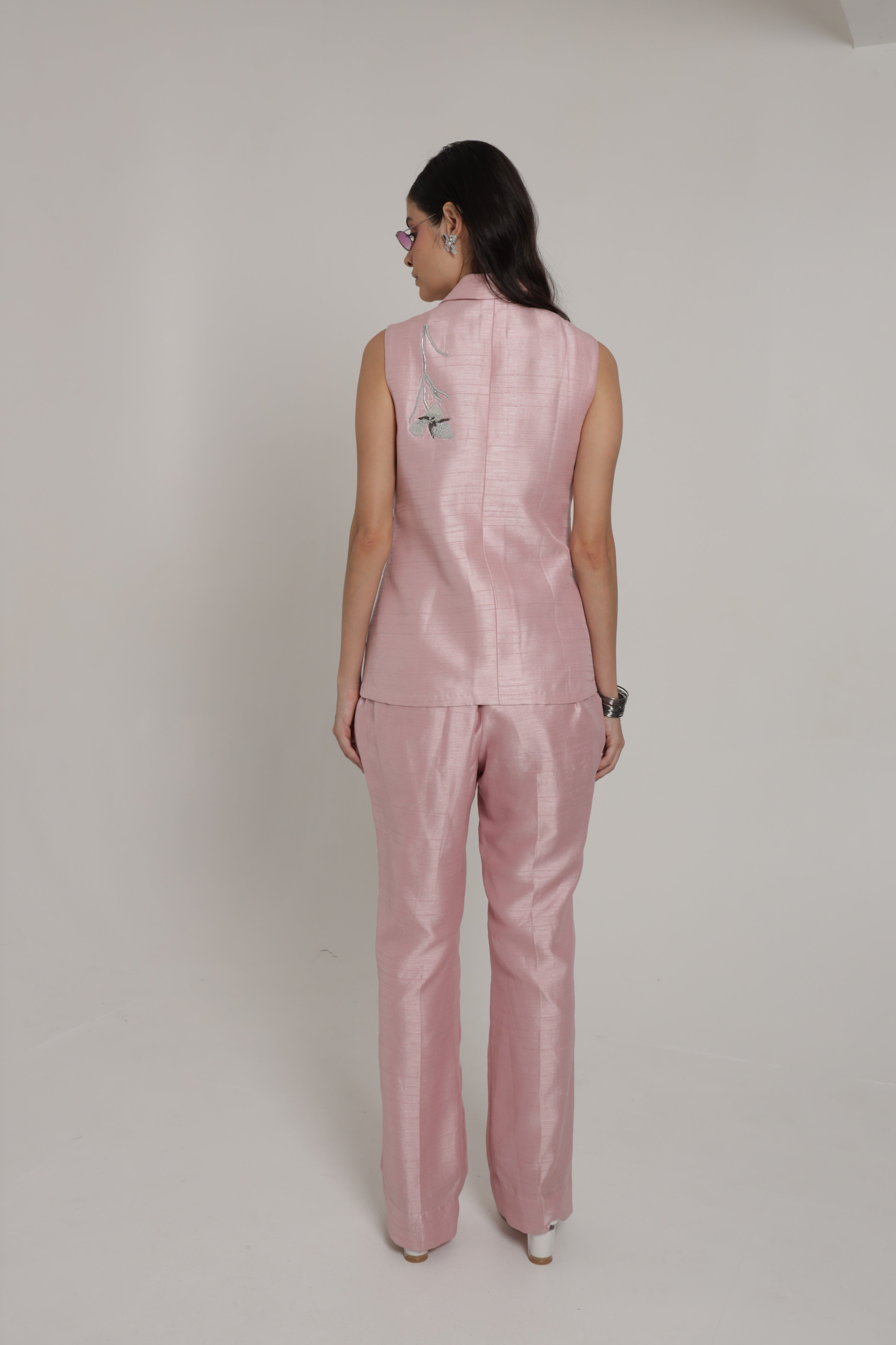 Light pink sleeveless jacket set with straight pant and bustier