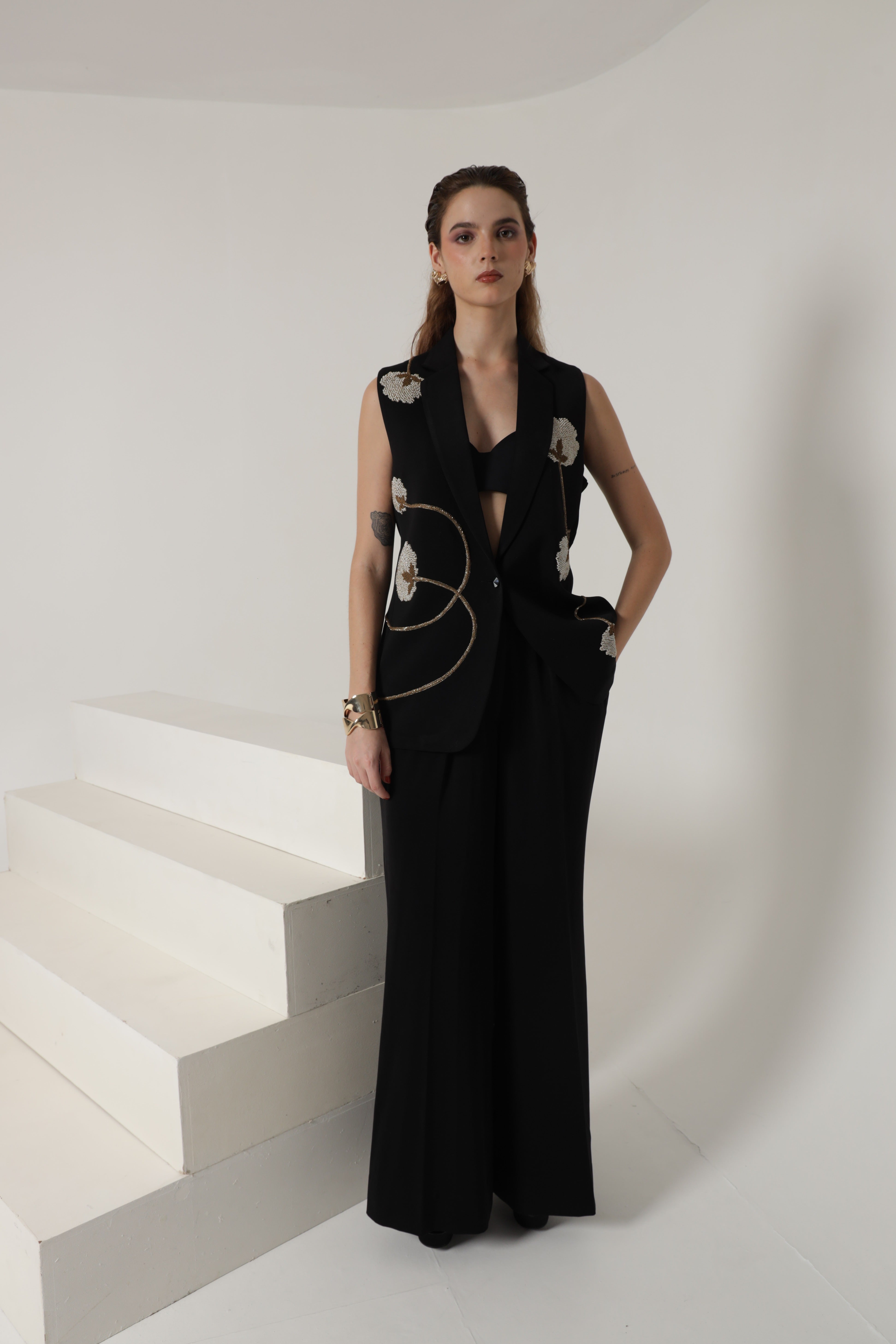 Blacksleeveless jacket with wide leg pant and bustier