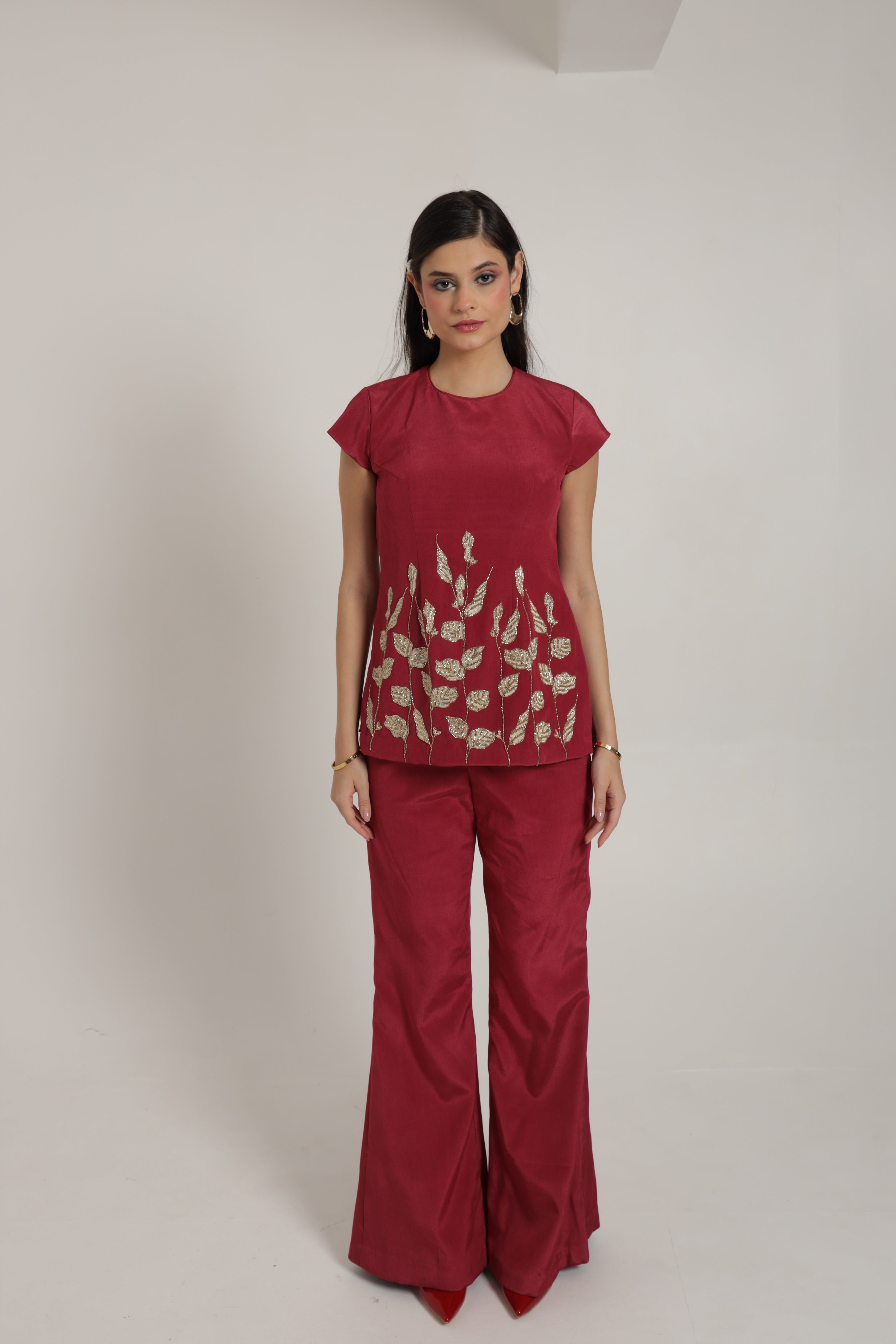 Dark pink short top with cape sleeves and bell bottom pants