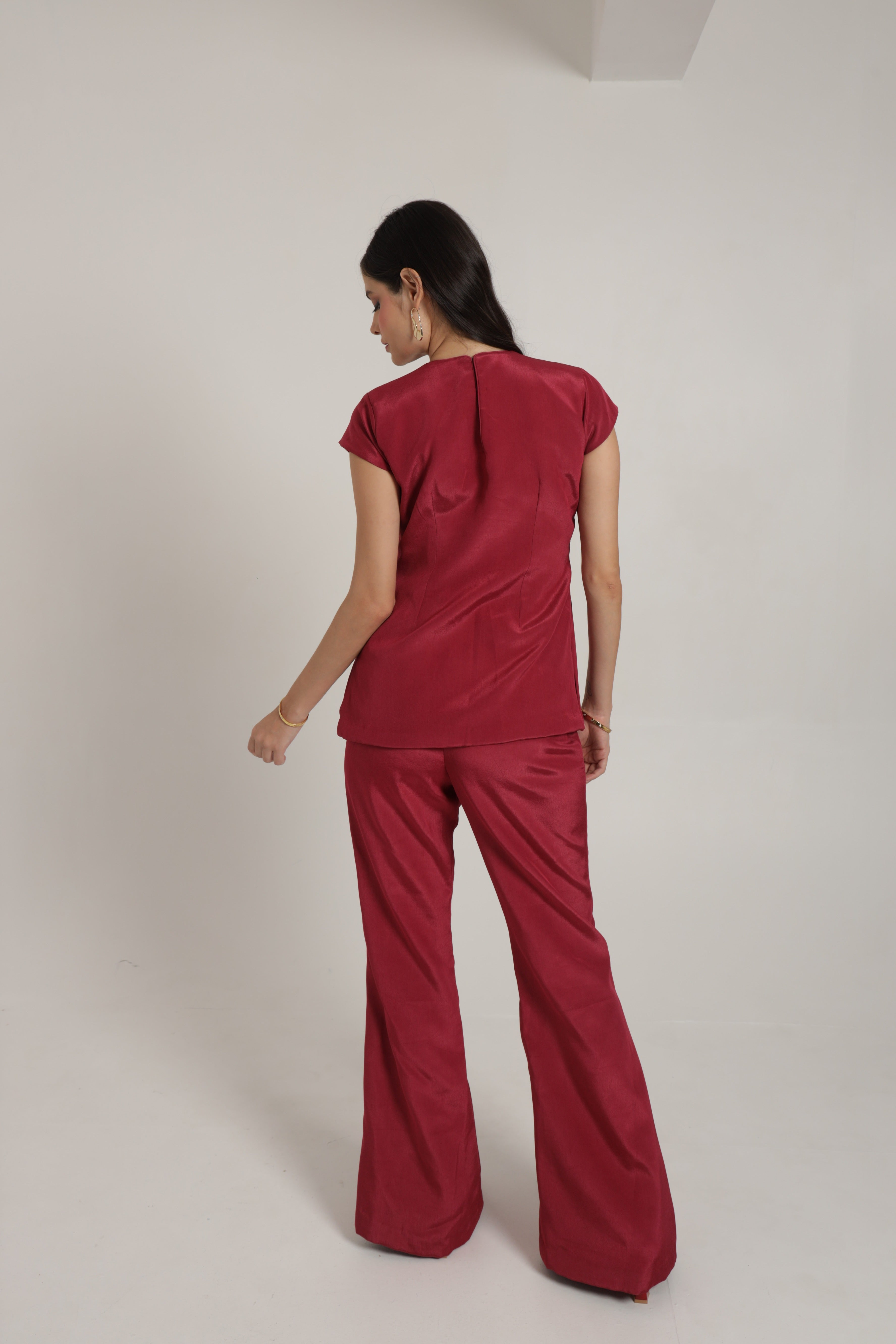 Dark pink short top with cape sleeves and bell bottom pants
