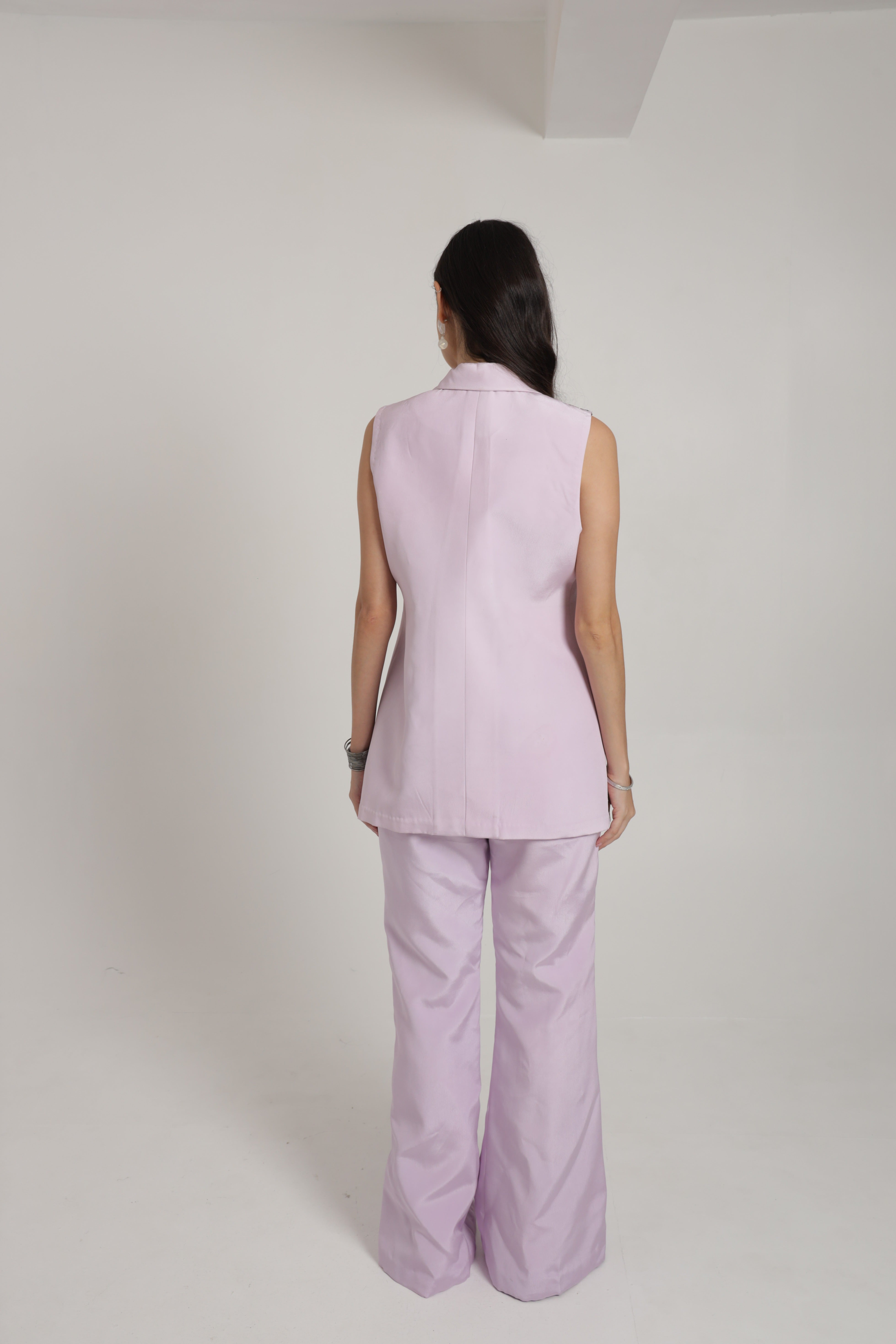 Lavender sleeveless jacket with bell bottom pants and bustier