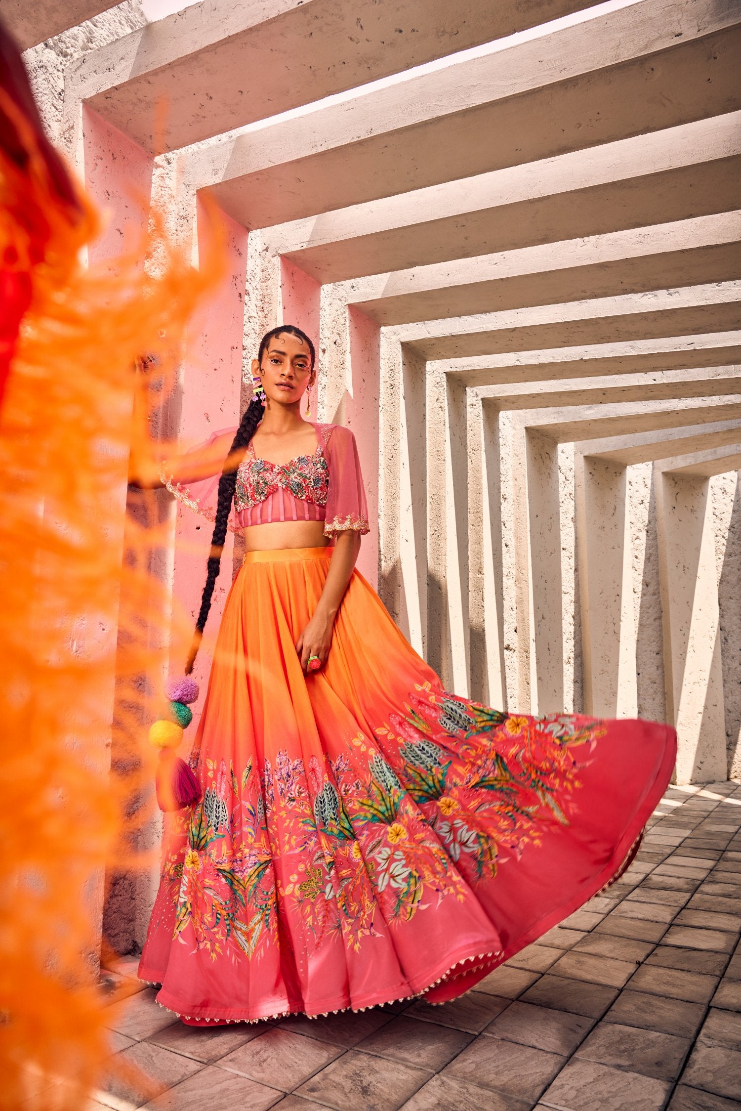 Double shaded floral printed skirt with beautifully hand embroidered corset and tulle cutwork cape.