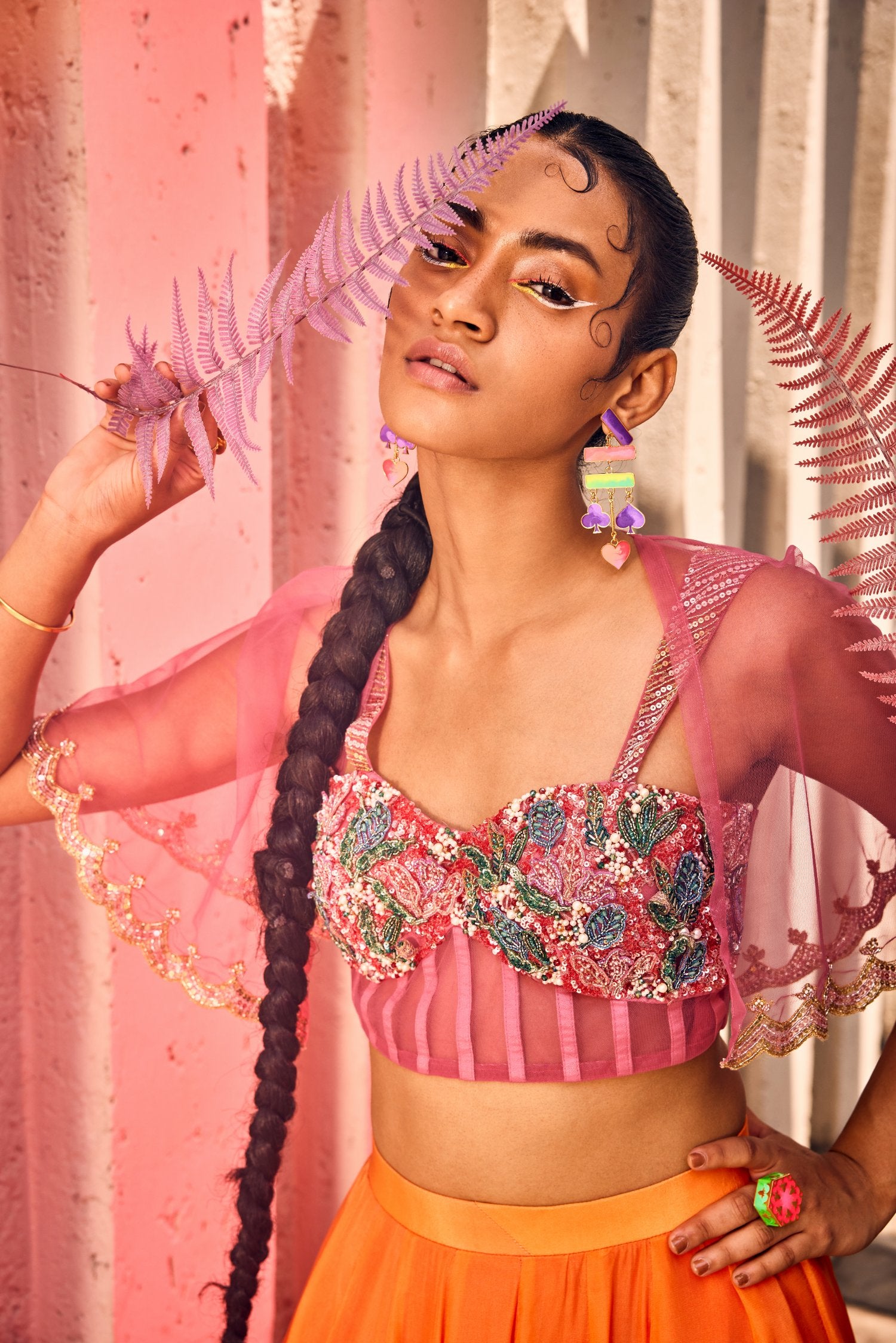 Double shaded floral printed skirt with beautifully hand embroidered corset and tulle cutwork cape.