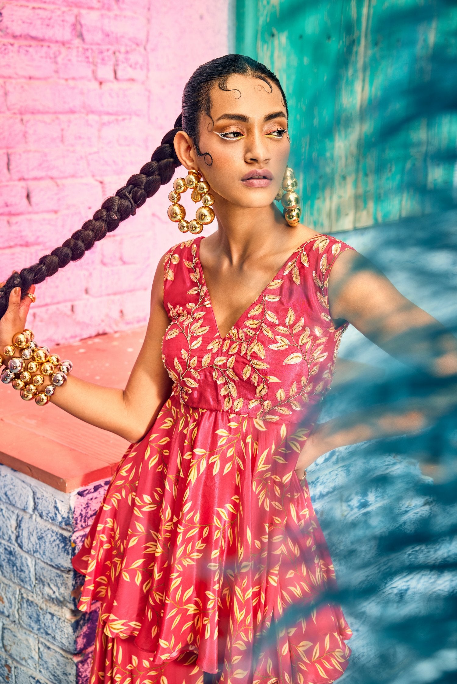 Rasberry pink digital printed flared gharara and hand embroidered tunic paired up with braided belt.