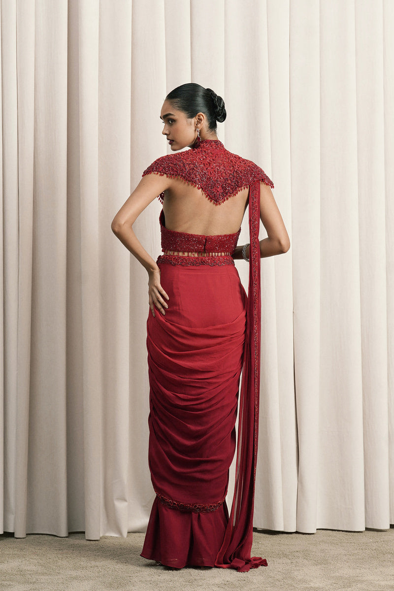 RED DRAPED SAREE WITH CAPE AND BUSTIER