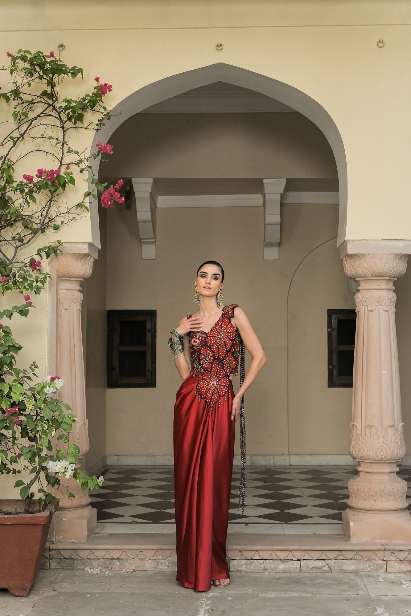 SCARLETTE DHOTI FLOWER PATCH TASSEL SAREE PAIRED. WITH THREAD WORK HIGHLIGHT CORSET BLOUSE