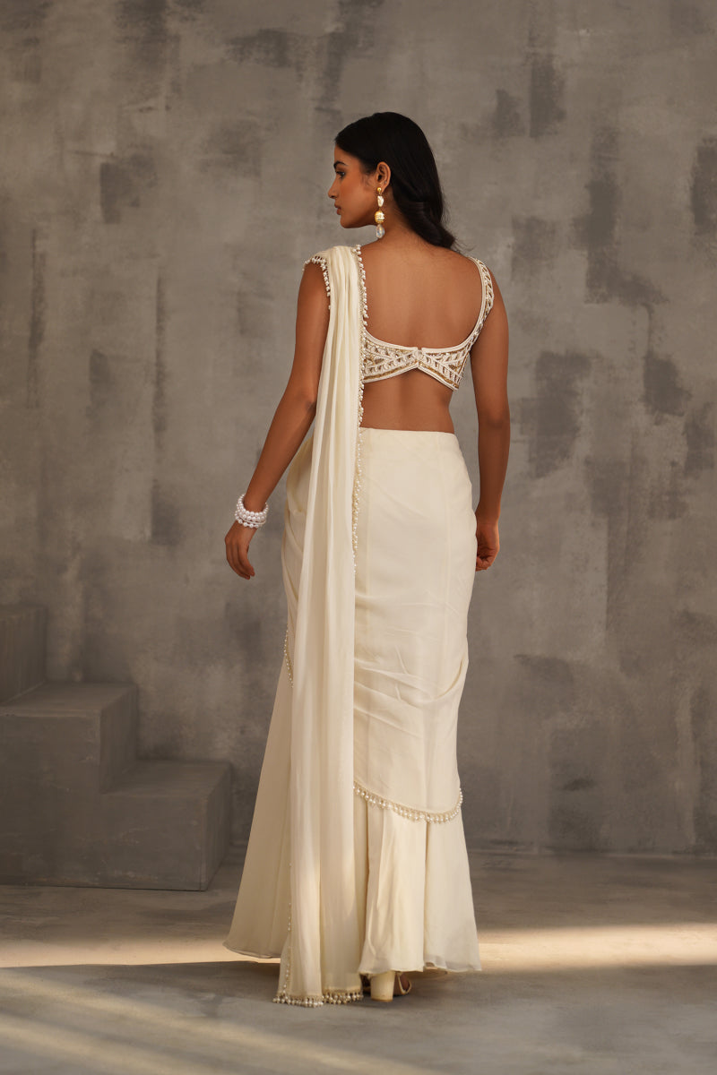Ivory Embroidered Blouse And Stitched Draped Saree