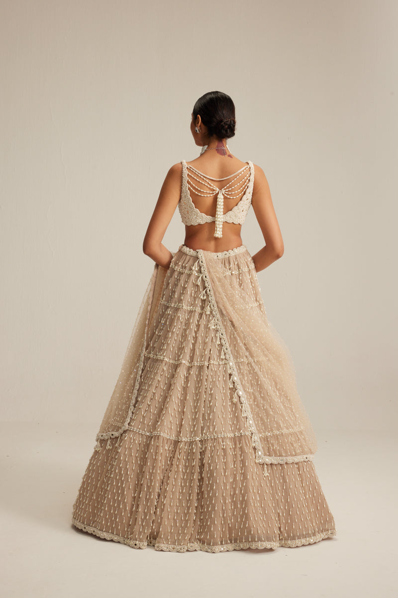 Light Beige Pearl Drop Multi Tier Lehenga Set.