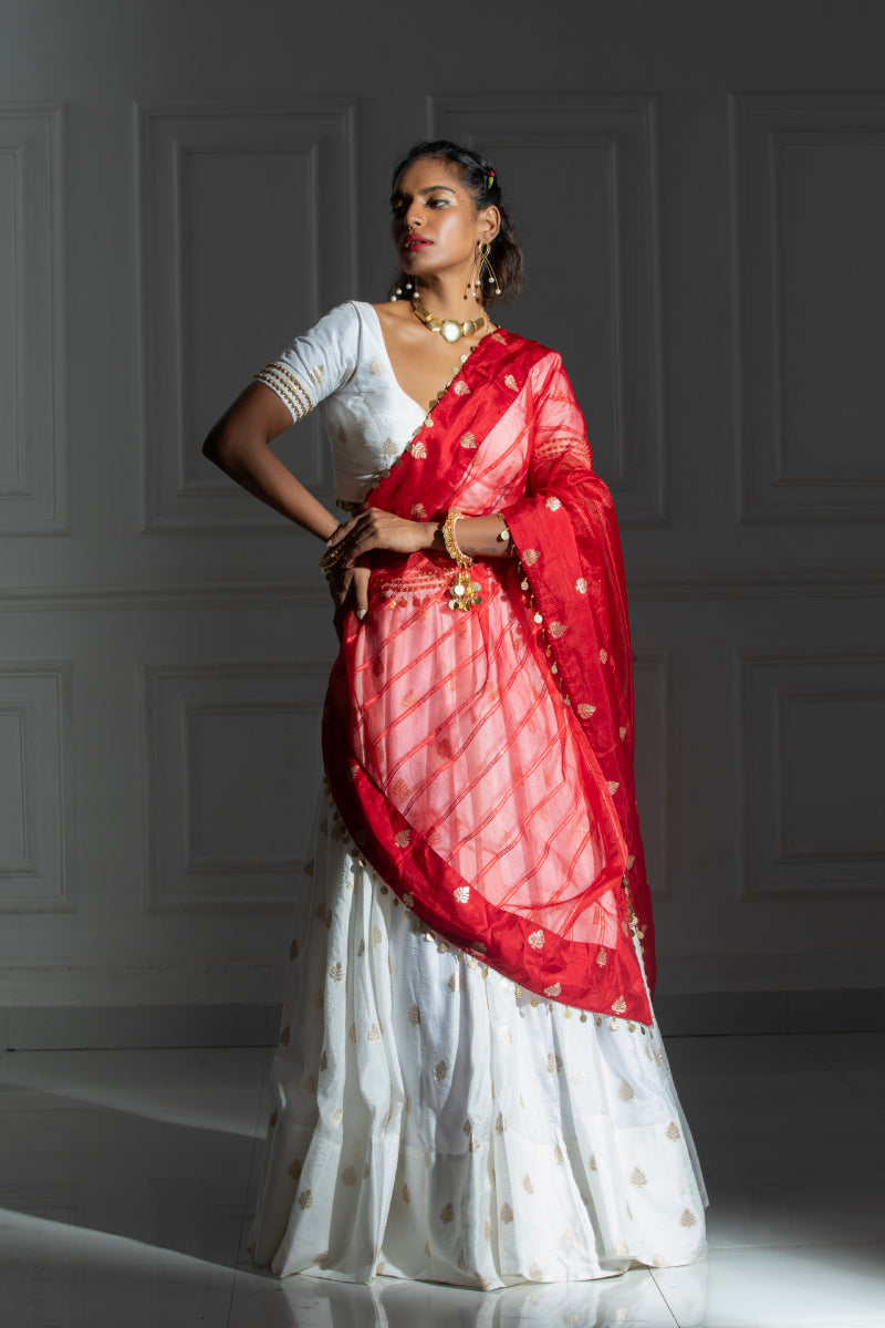 White Lehenga set with coin detailing blouse and red dupatta