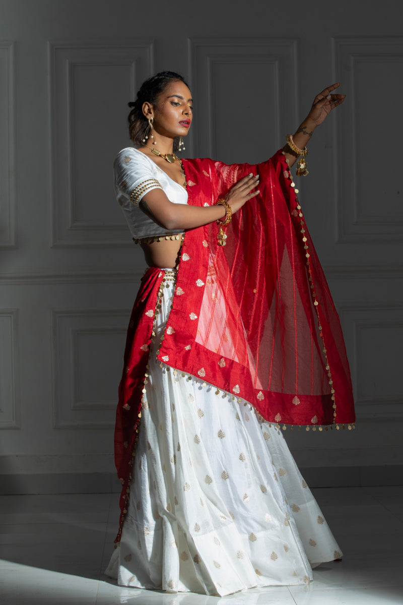 White Lehenga set with coin detailing blouse and red dupatta