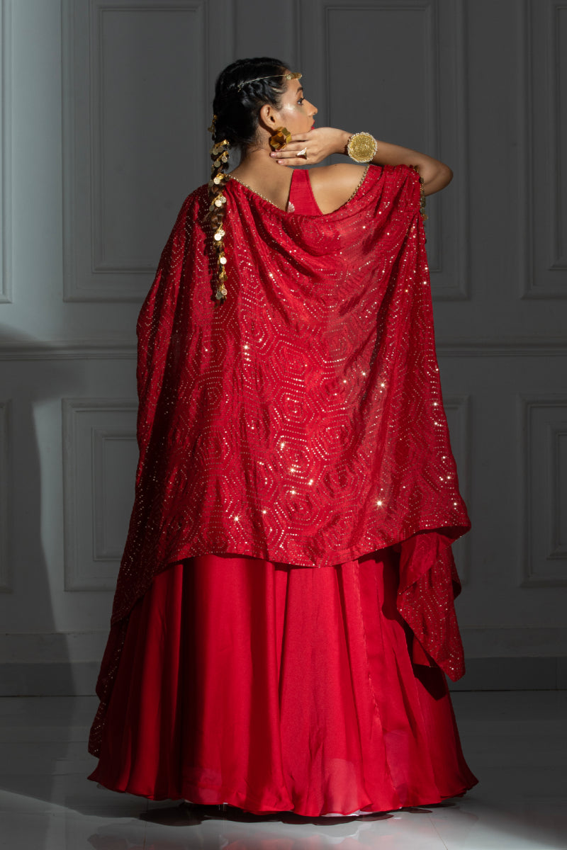 Silk lehenga set with red blouse and coin detailing cape