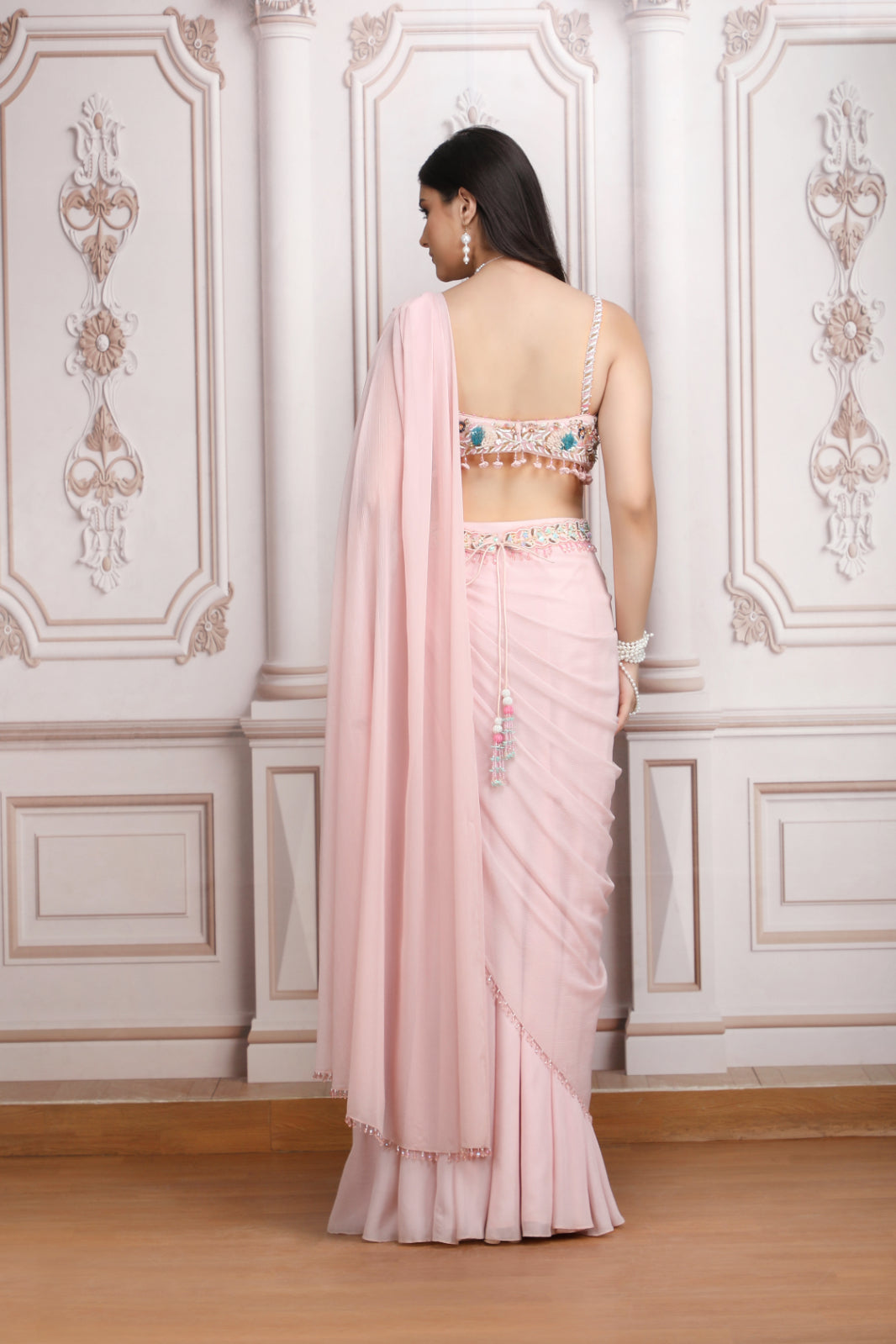 A Pastel Pink Drape Saree With A Hand Embroidered Blouse