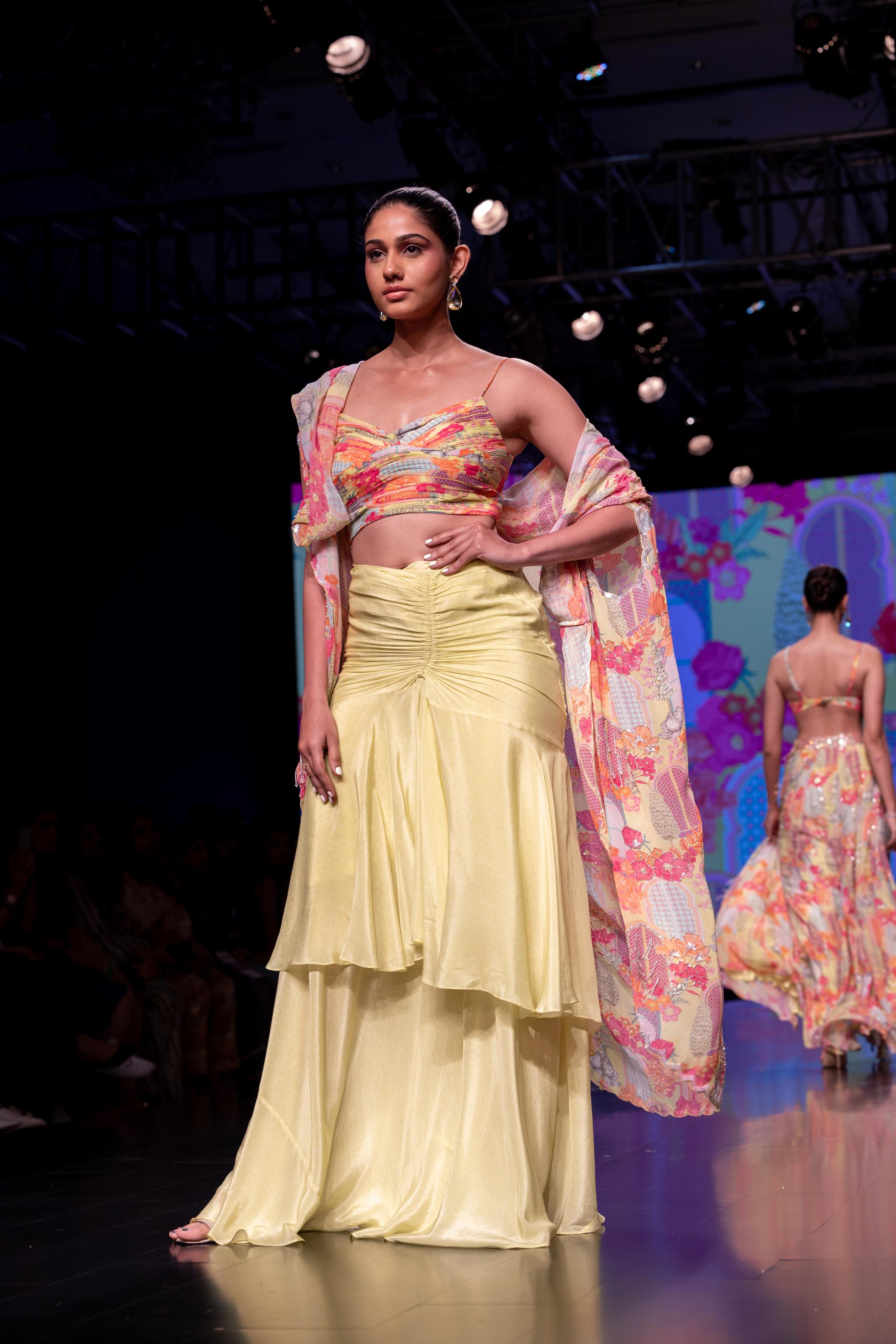 Pleated Blouse With Layered Skirt Paired With Printed Cape