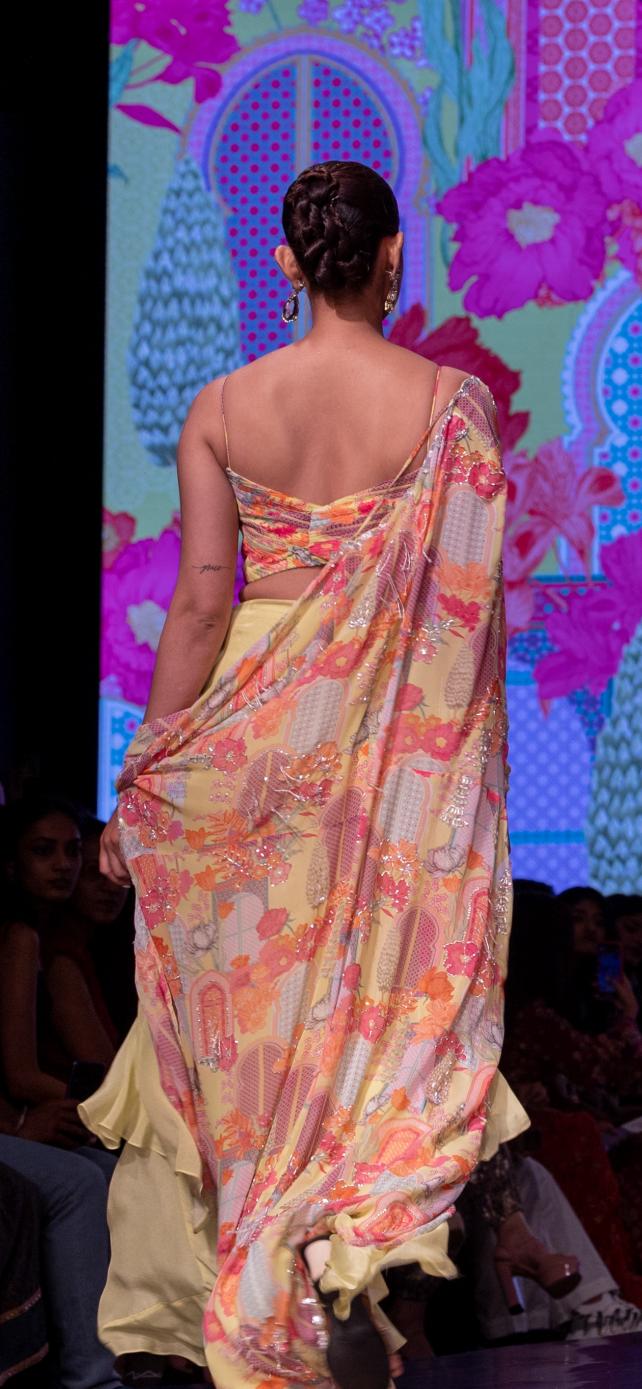 Pleated Blouse With Layered Skirt Paired With Printed Cape