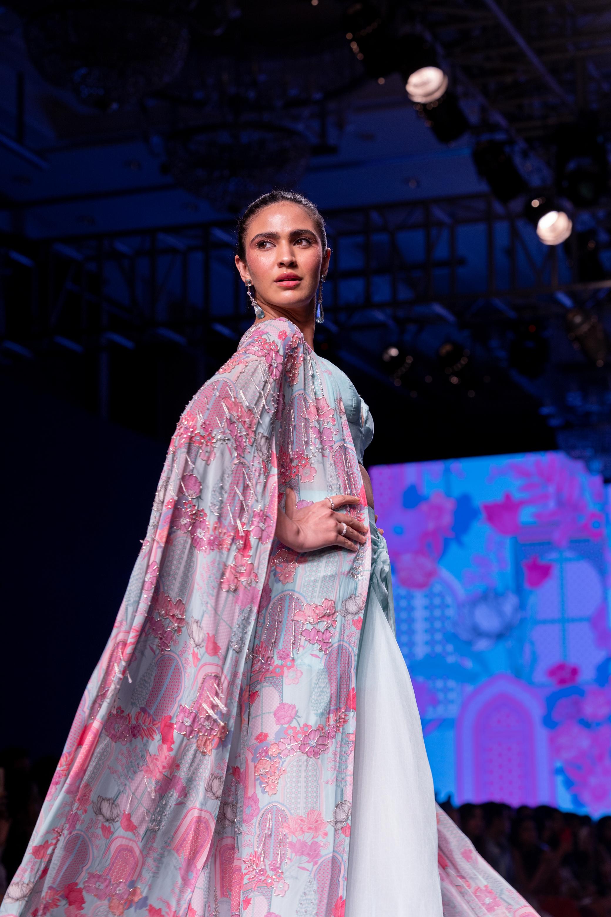 Powder Blue Blouse With Dhoti Skirt & Printed Embroidered Cape