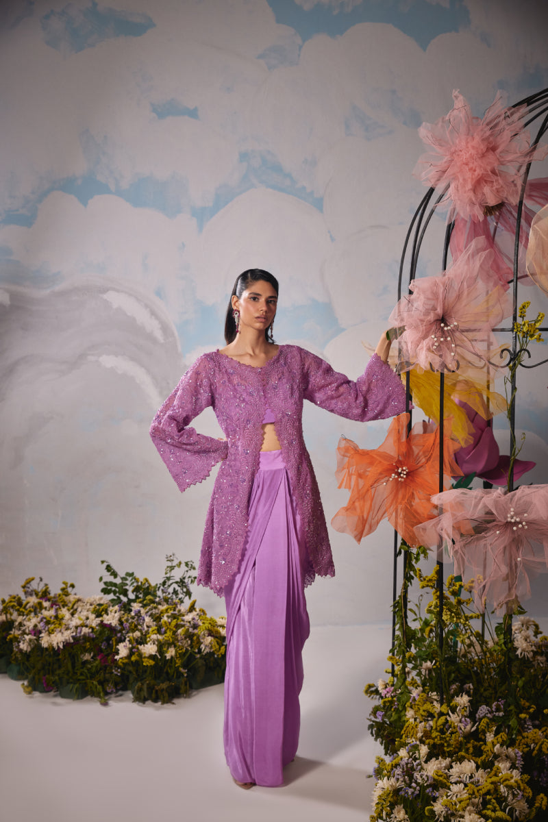 Lavender organza jacket with self dori embroidery paired with drape skirt and bustier