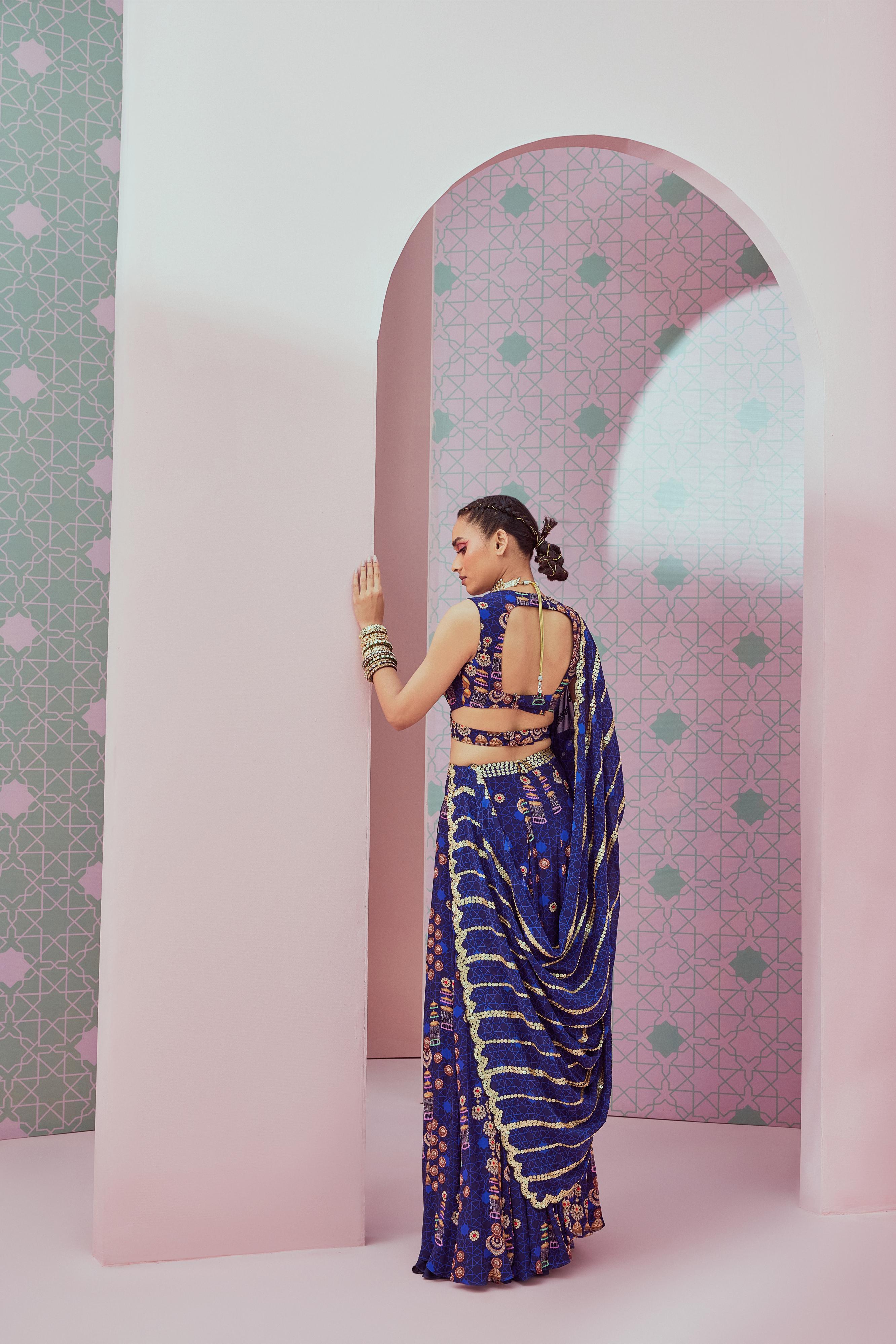 Blue criss cross blouse with slit lehenga paired up with heavy embellished dupatta