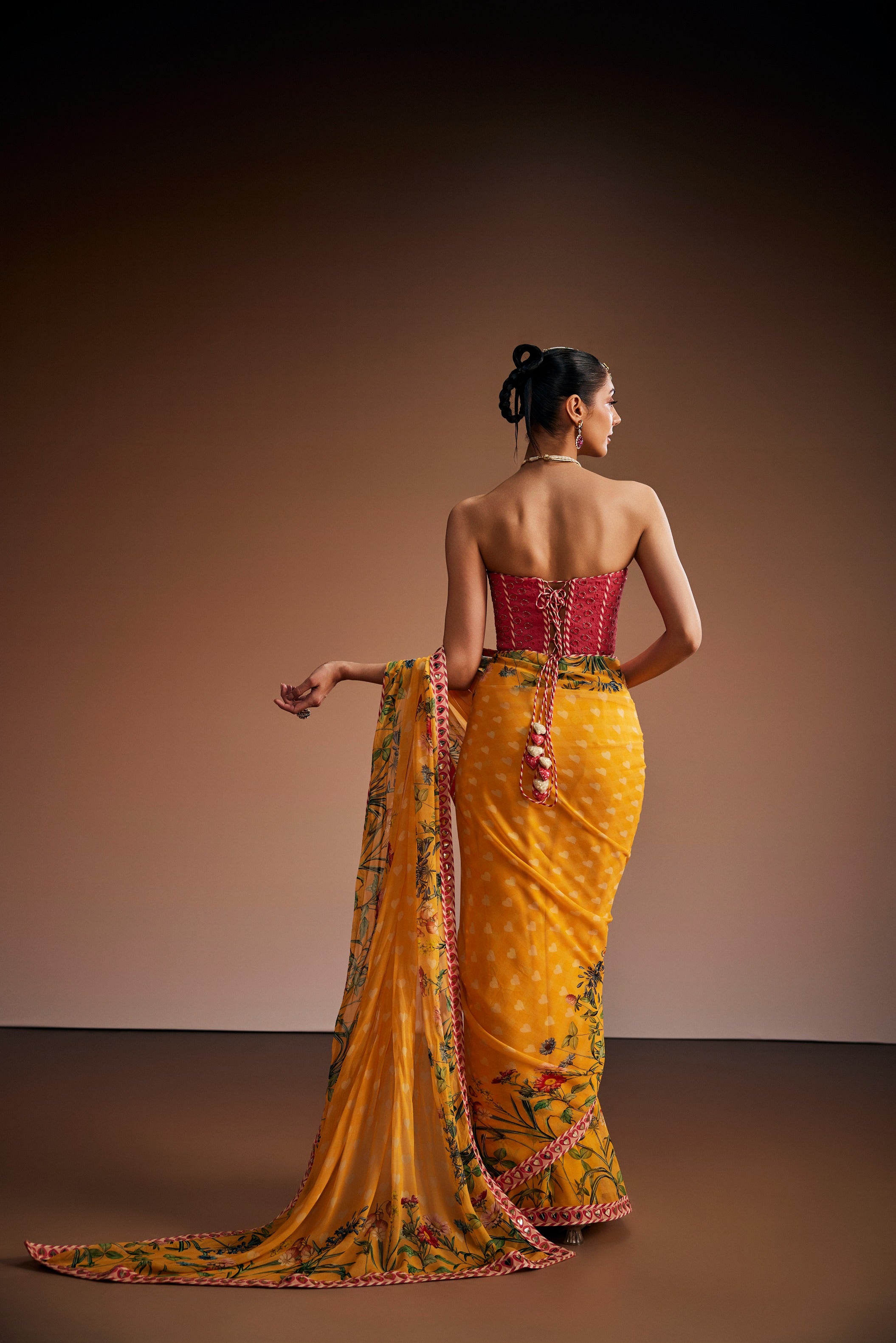 Mustard Floral Saree Paired With Pink Corset
