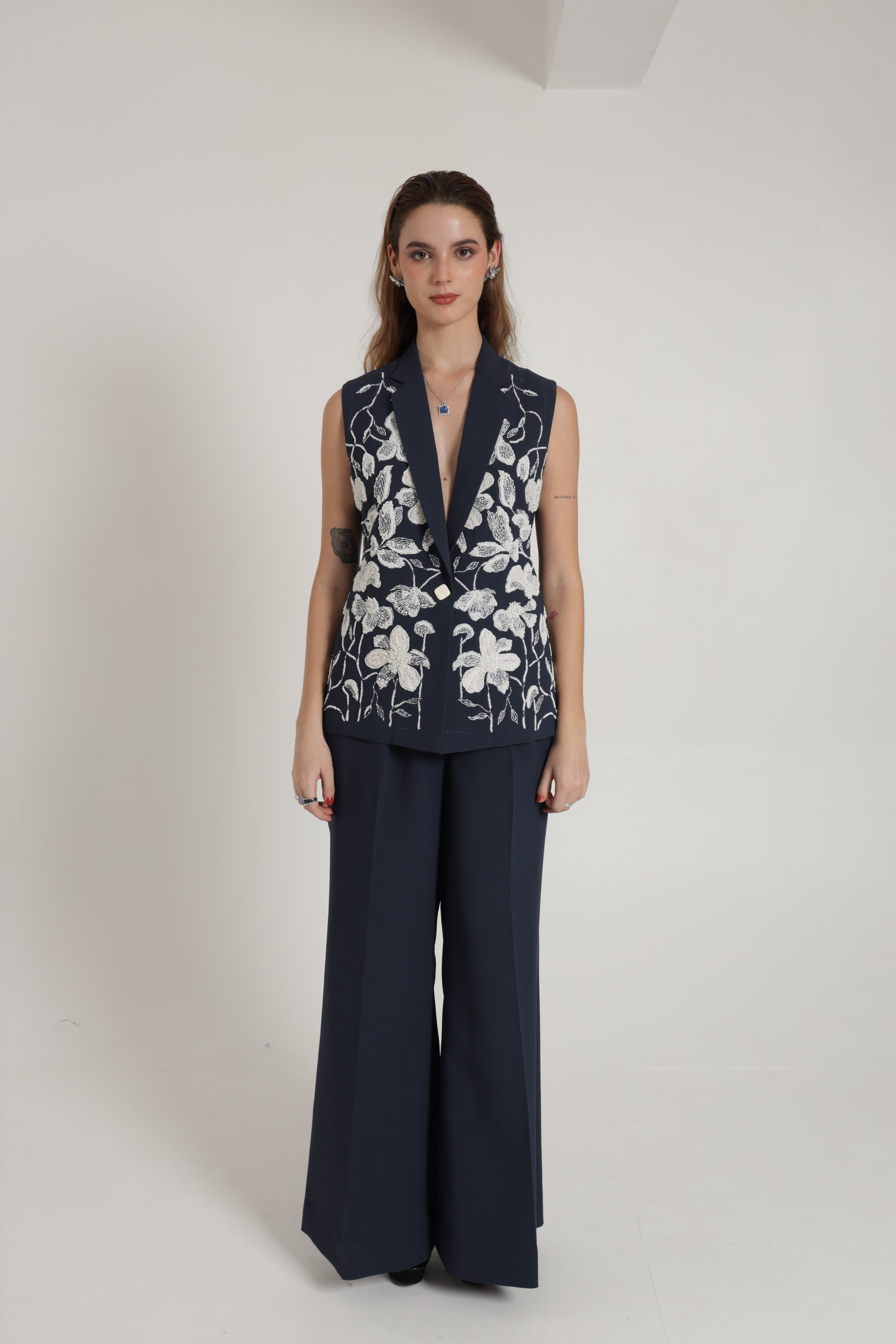 Dark blue sleeveless jacket with wide leg pant