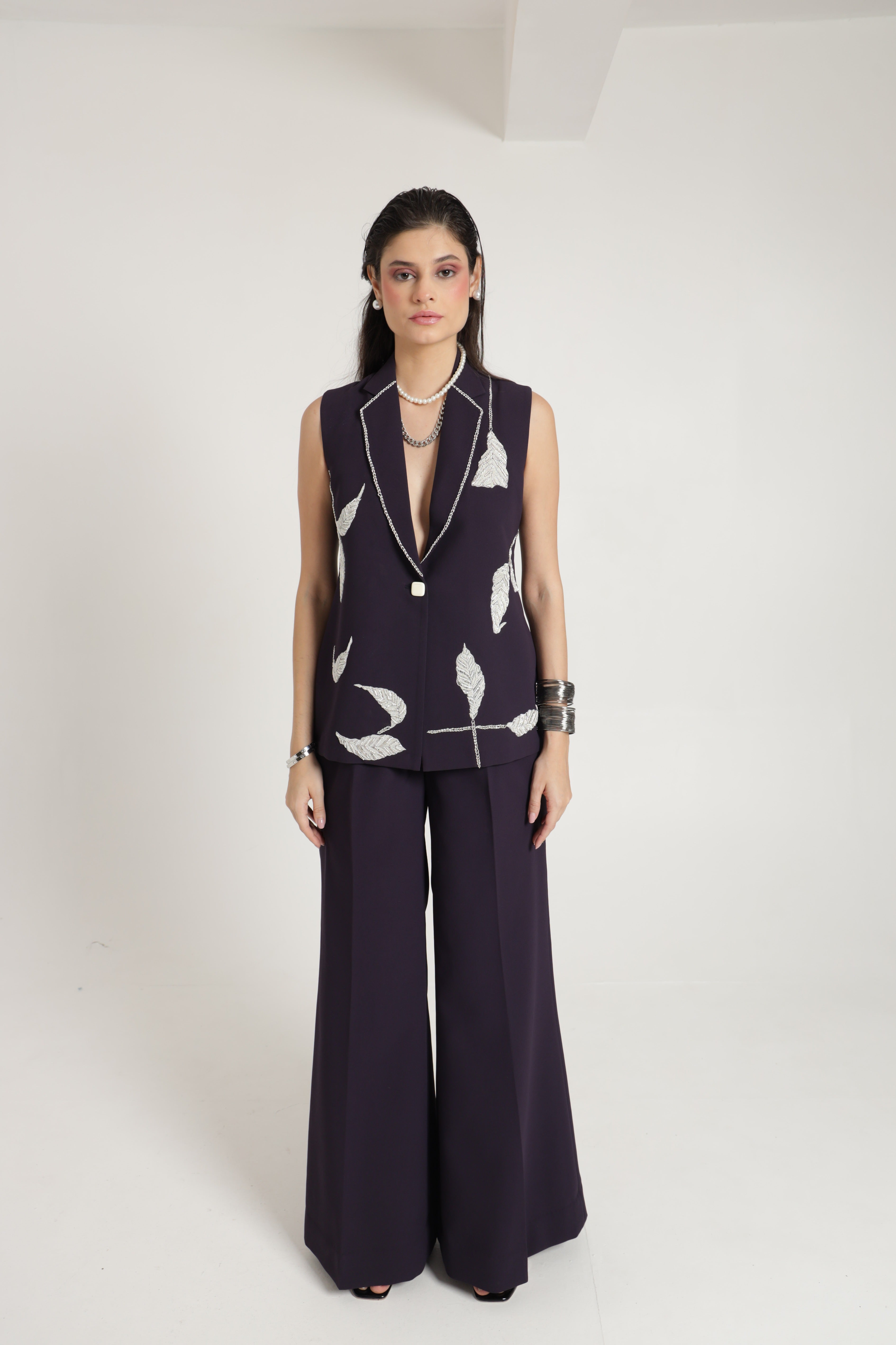 Dark wine sleeveless jacket with wide leg pant and bustier