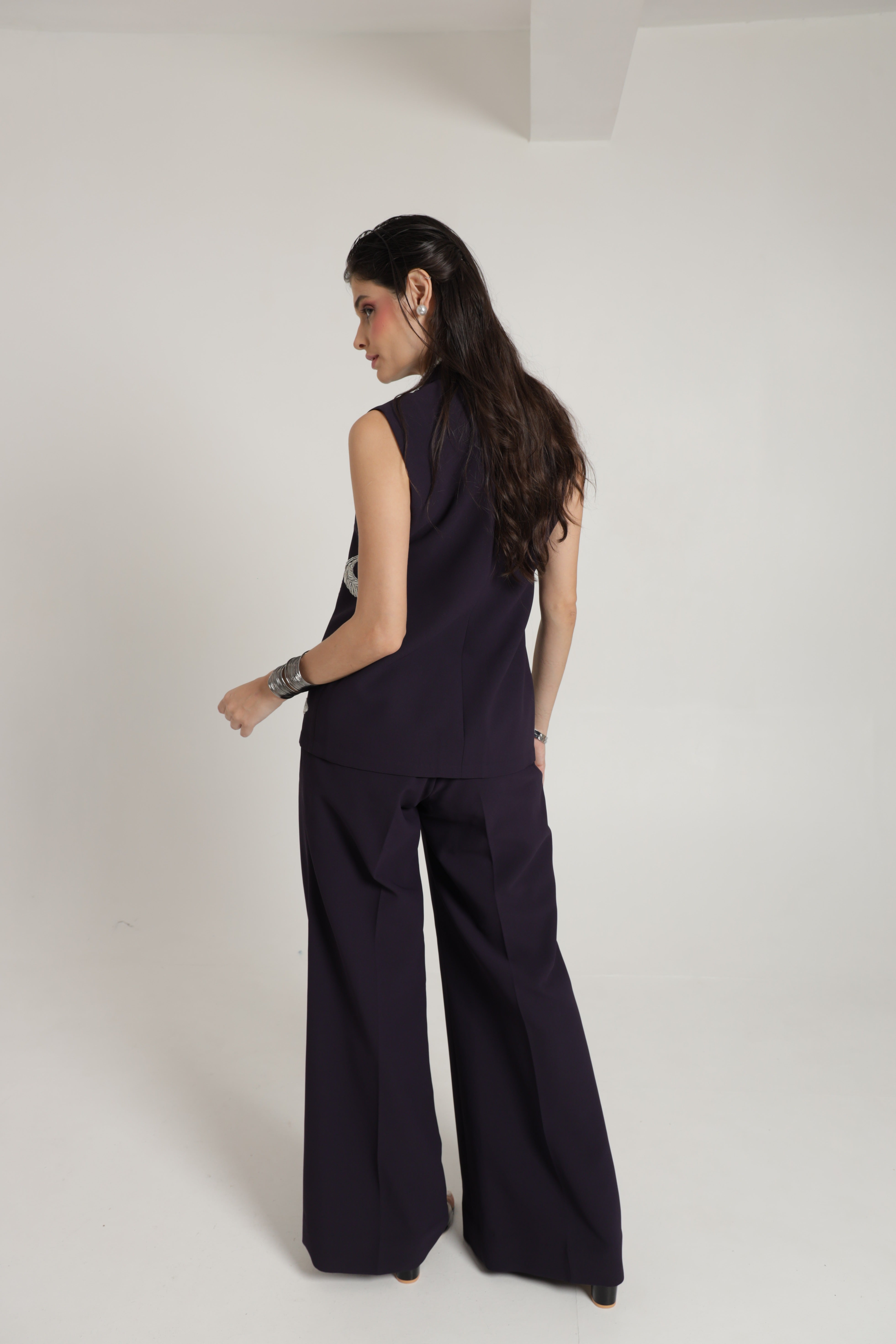 Dark wine sleeveless jacket with wide leg pant and bustier