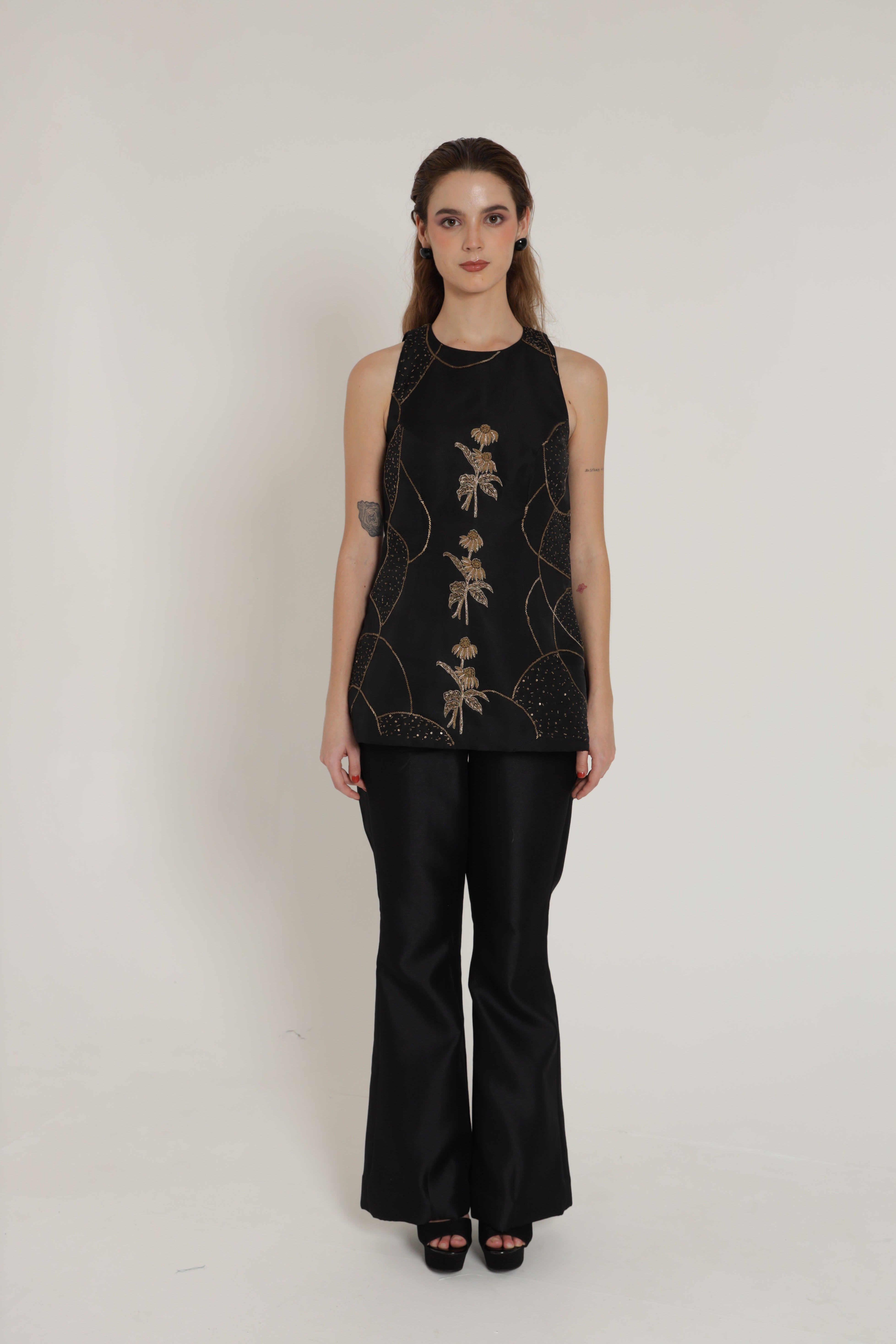 Black halter neck top with bell bottom pants
