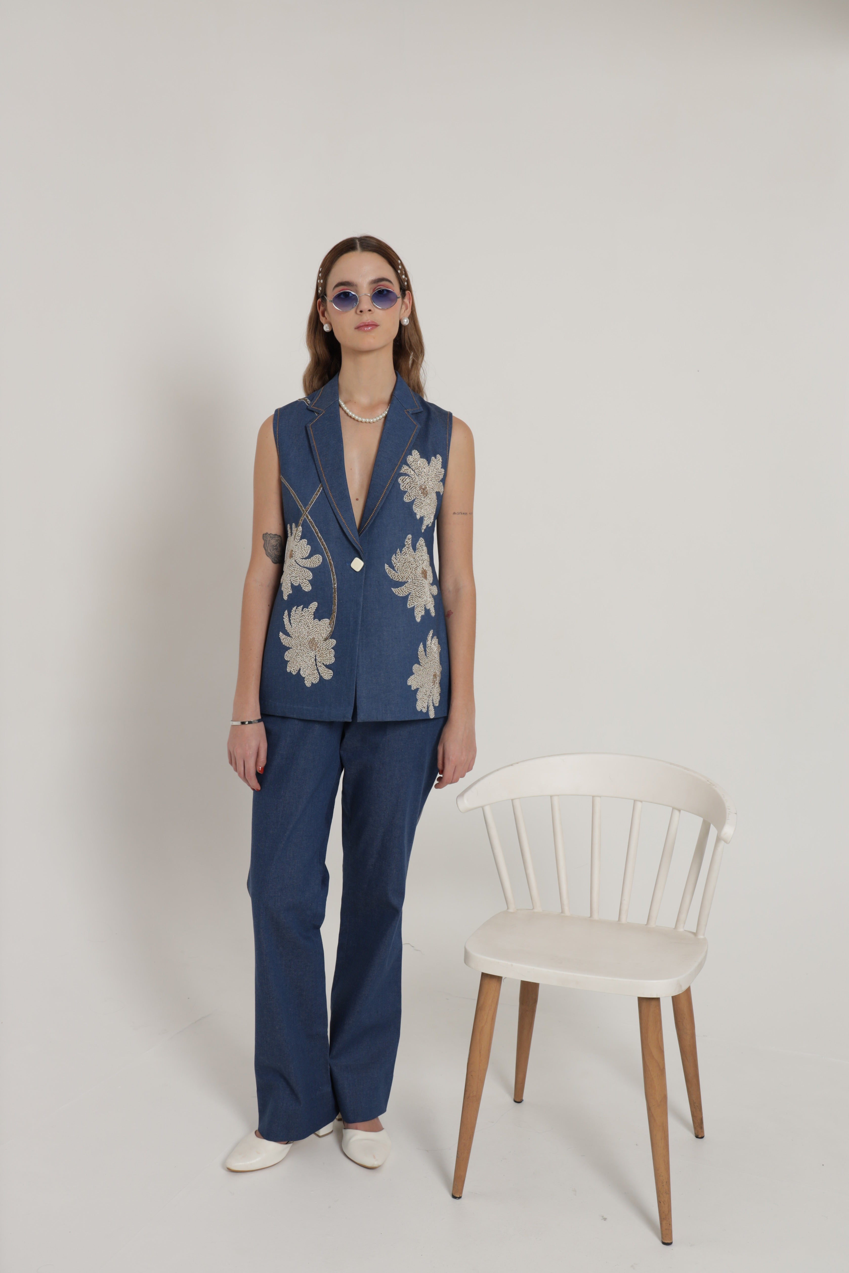 Ink blue sleeveless jacket with wide leg pant and bustier