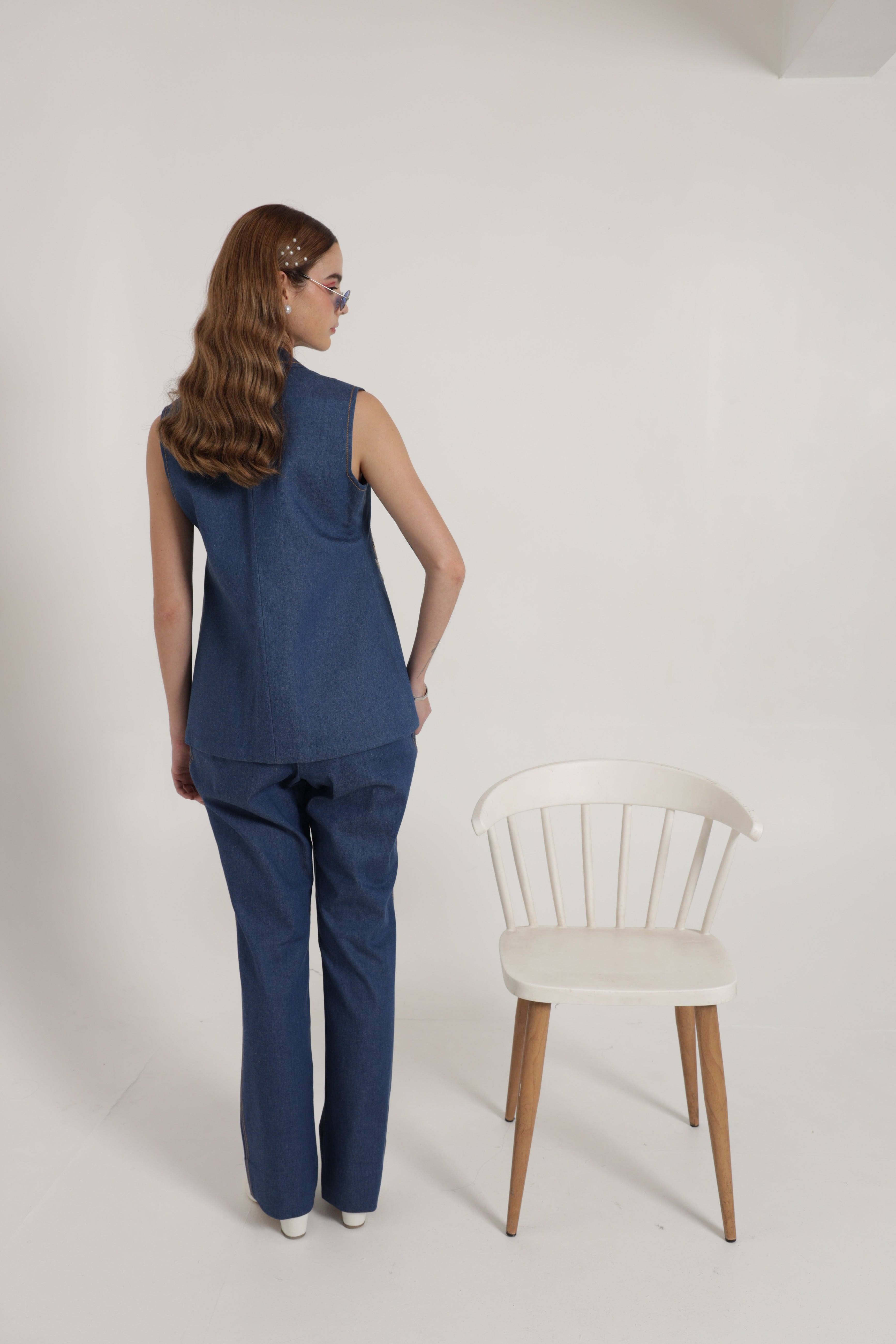 Ink blue sleeveless jacket with wide leg pant and bustier