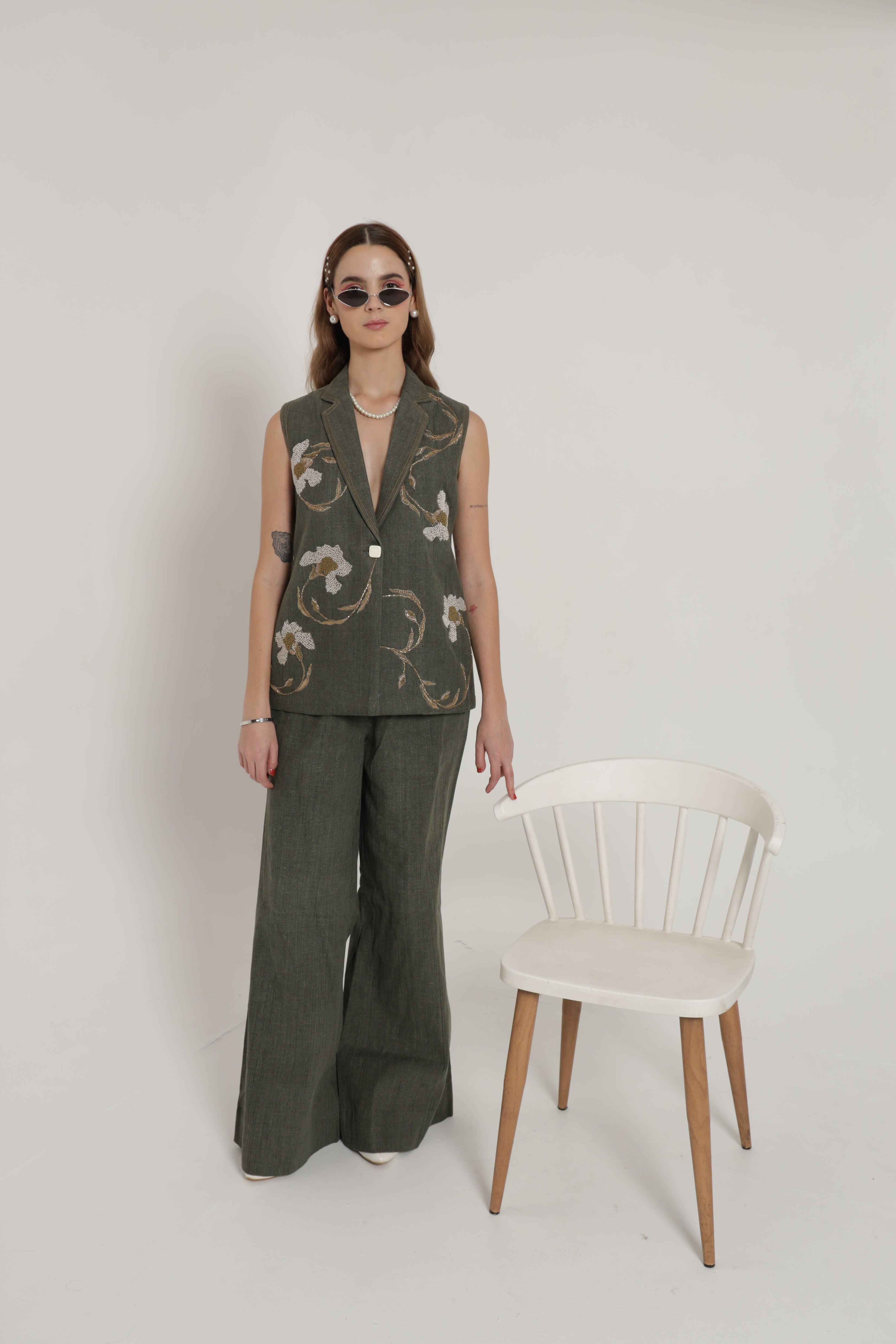 Green sleeveless jacket set with wide leg pants and bustier