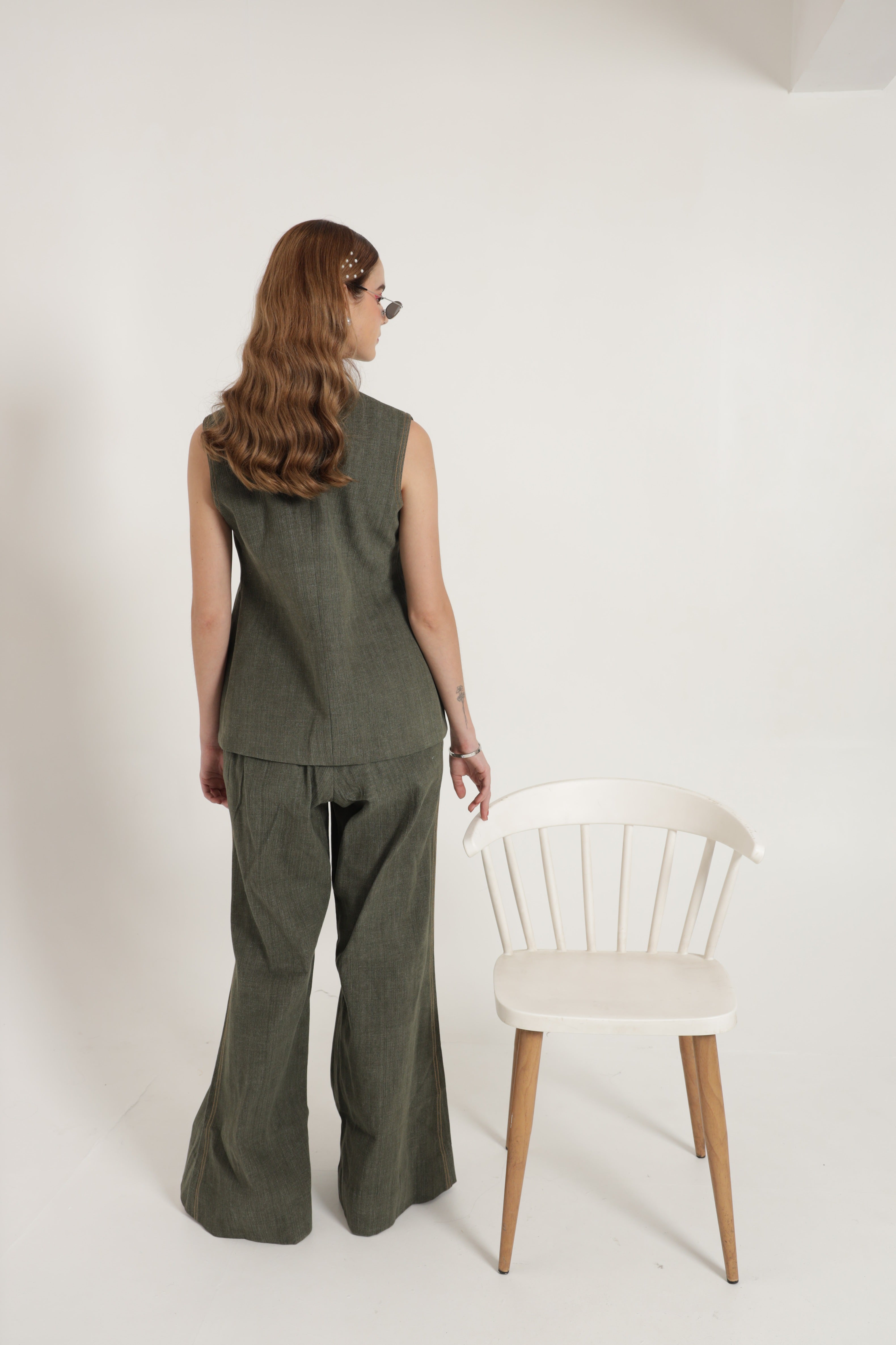 Green sleeveless jacket set with wide leg pants and bustier