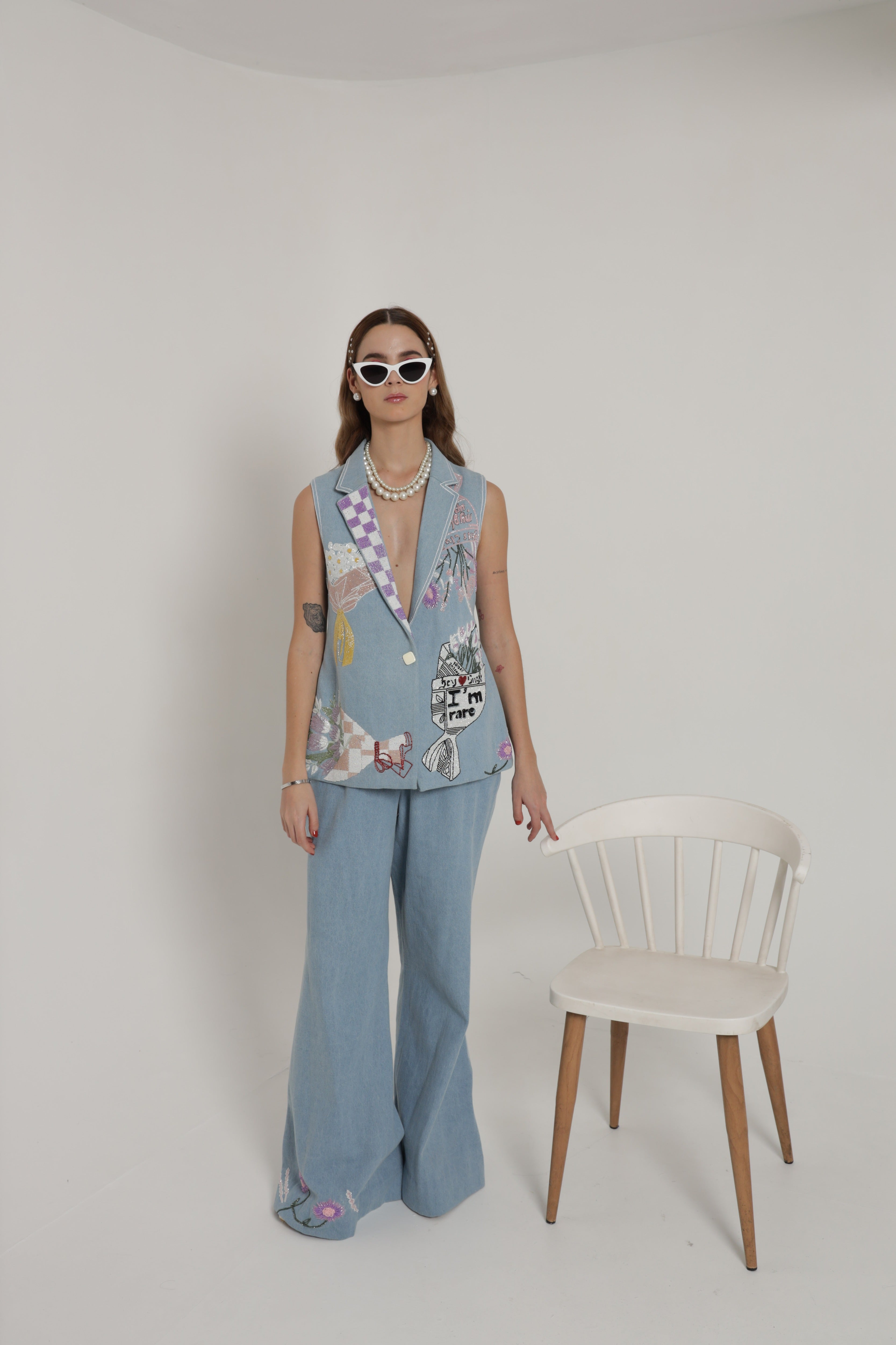Light blue sleeveless jacket set with wide leg pants and bustier