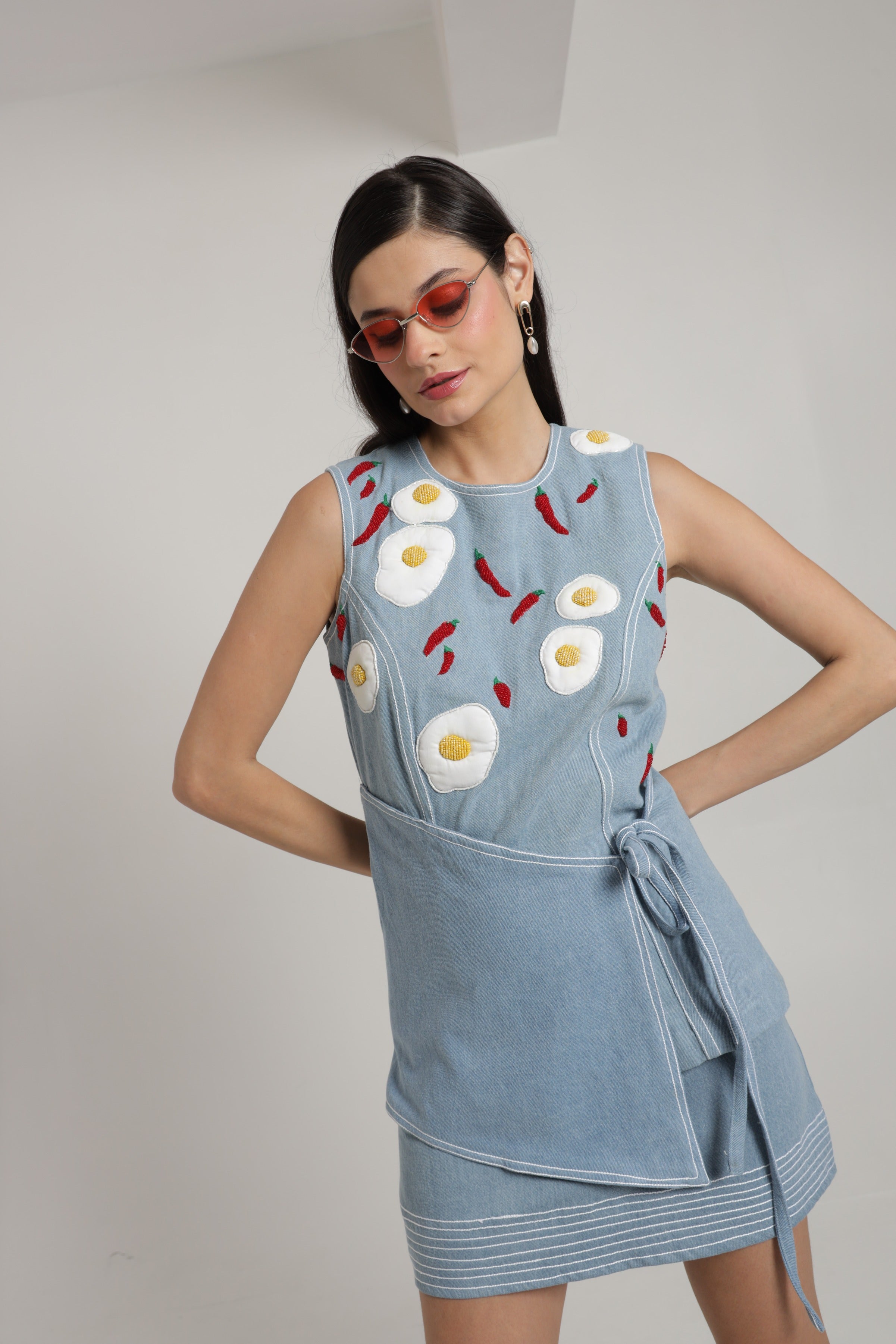 Light blue denim sleeveless top with mini skirt