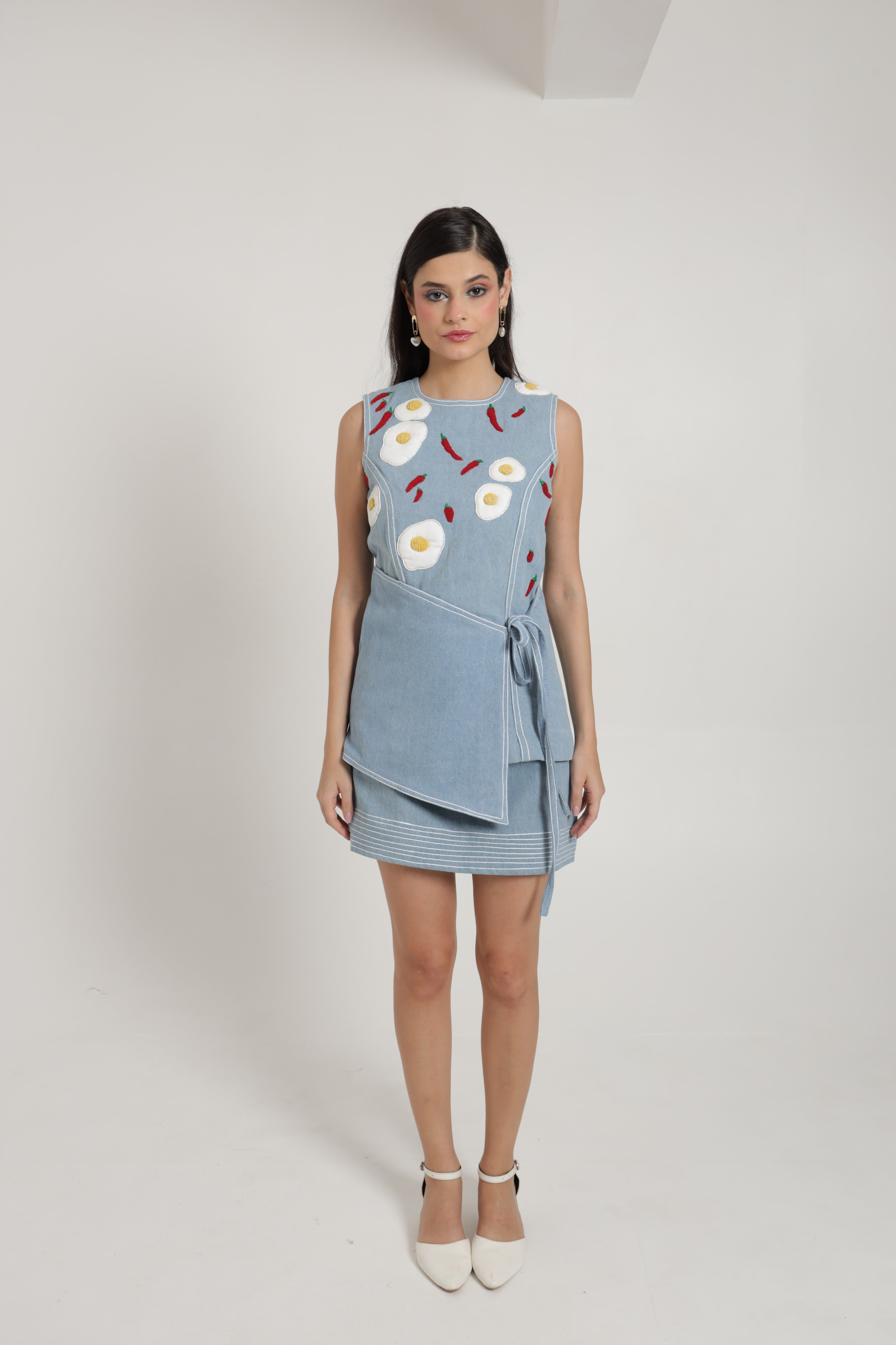 Light blue denim sleeveless top with mini skirt