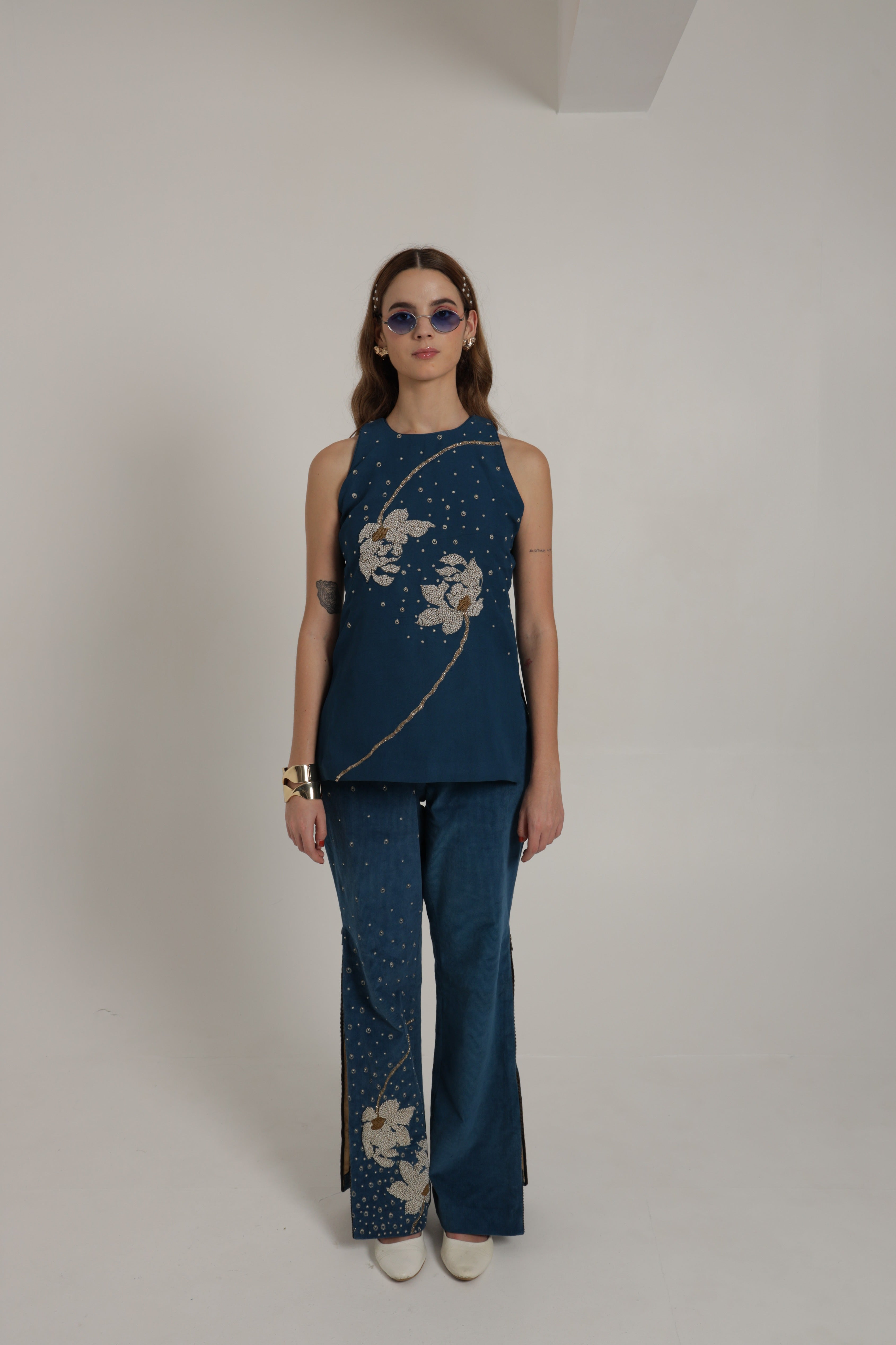 Dark blue halter top with straight corduroy pants