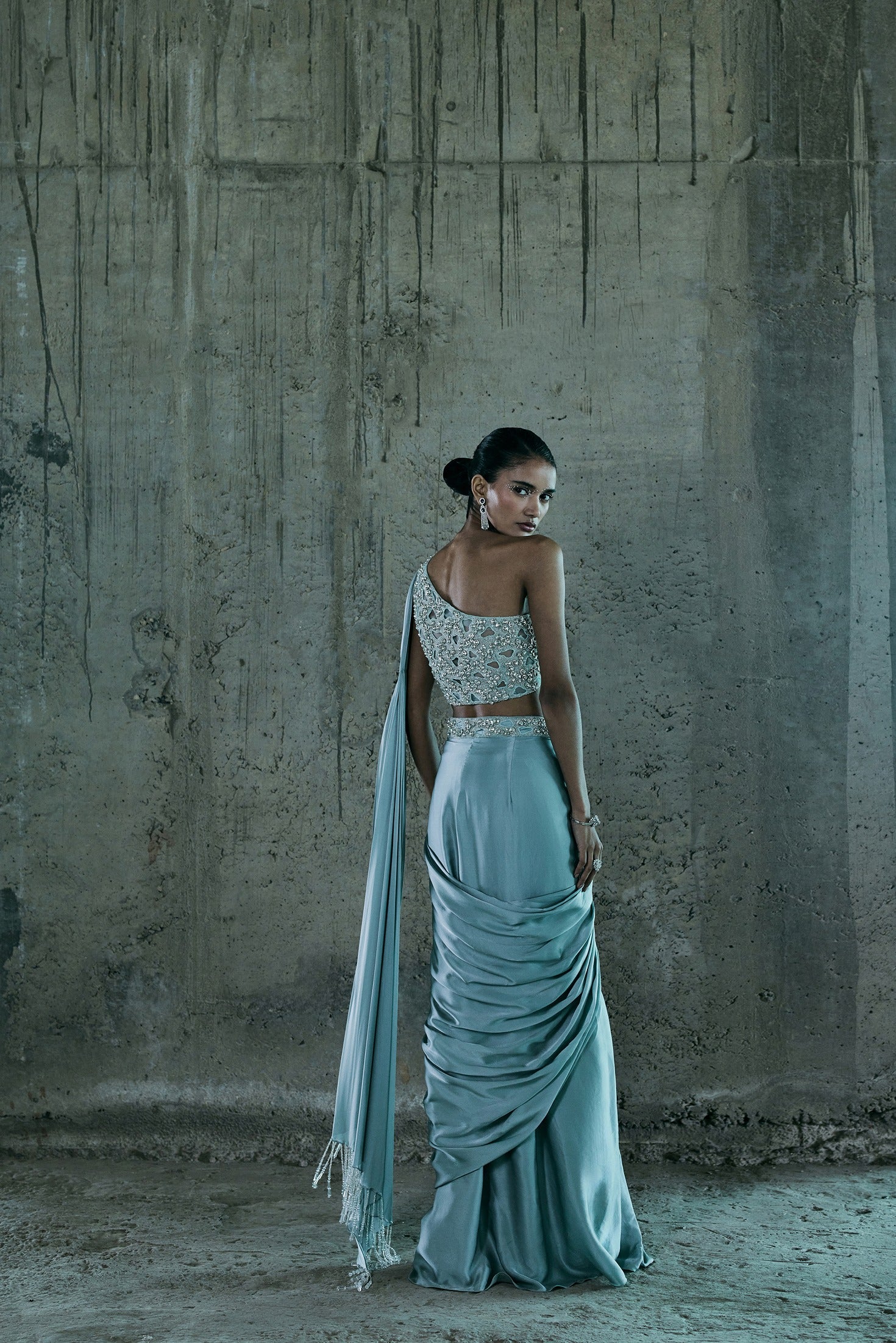 Ice Blue Stone Embellished Bustier Paired With Drape Saree