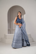 Load image into Gallery viewer, Silver Blue Soft Silk Lehenga Set with Mirror Embellishements.
