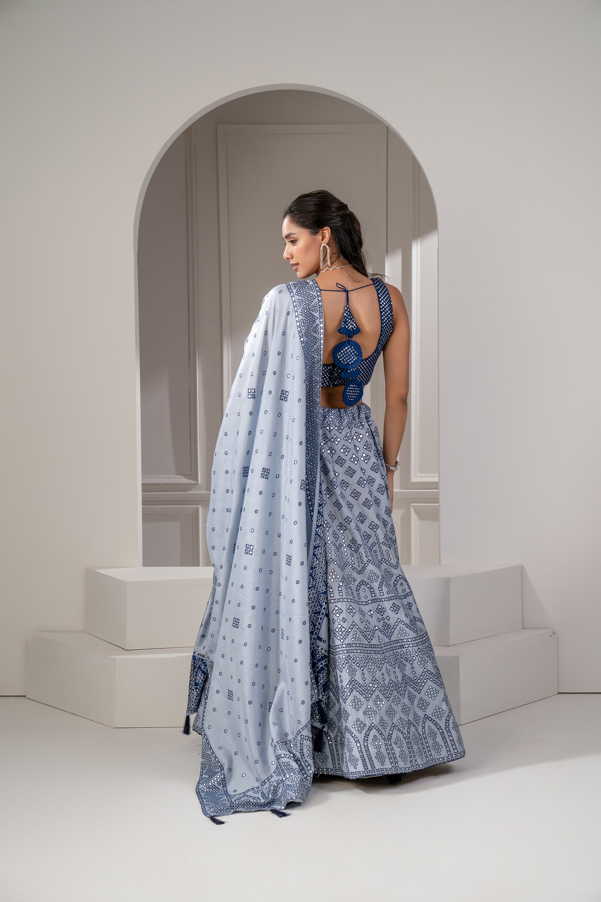 Silver Blue Soft Silk Lehenga Set with Mirror Embellishements.