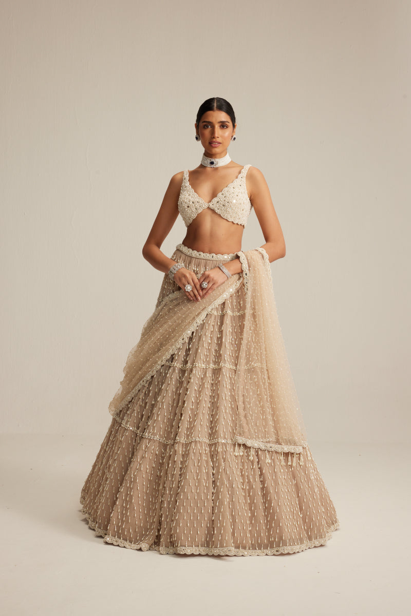 Light Beige Pearl Drop Multi Tier Lehenga Set.