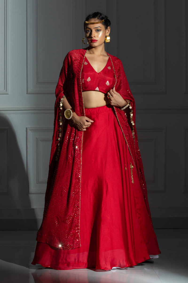 Silk lehenga set with red blouse and coin detailing cape