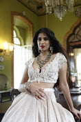 Load image into Gallery viewer, Ivory Pan Neck Cap Sleeves Choli with Ivory Pleated Lehenga Skirt with Net Dupatta
